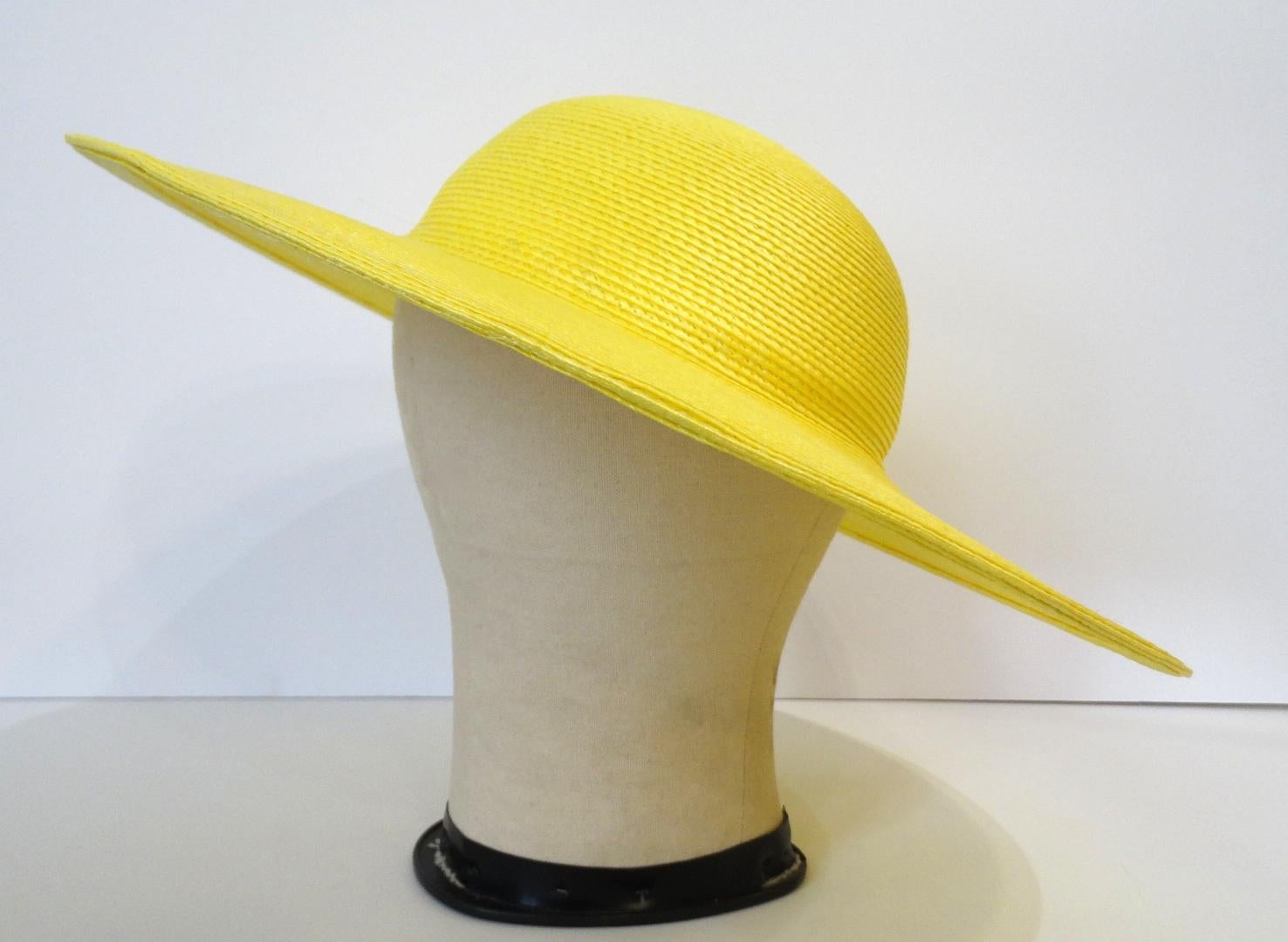 Channel Your Inner French Lady With This Parisian Style Hat! Circa 1960s, this bright yellow straw hat features a classic bowler style top and a wide brim. Perfect for your next getaway or brunch! 