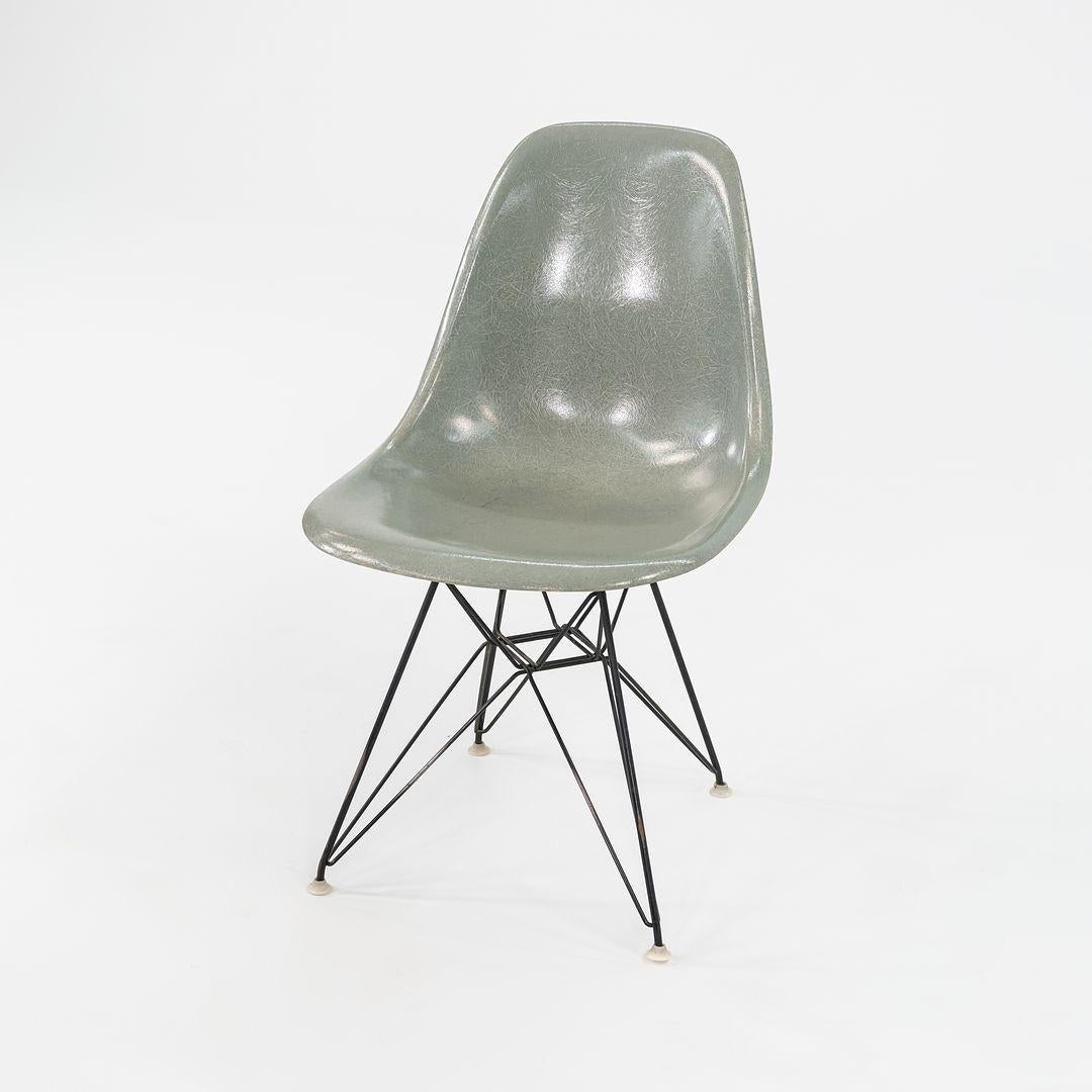 This is an Eames DSR Chair, originally designed by Ray and Charles Eames in the 1950s. This particular example was produced by Herman Miller in the USA C. 1961. The chair features a molded fiberglass shell in seafoam green, and has an Eiffel base
