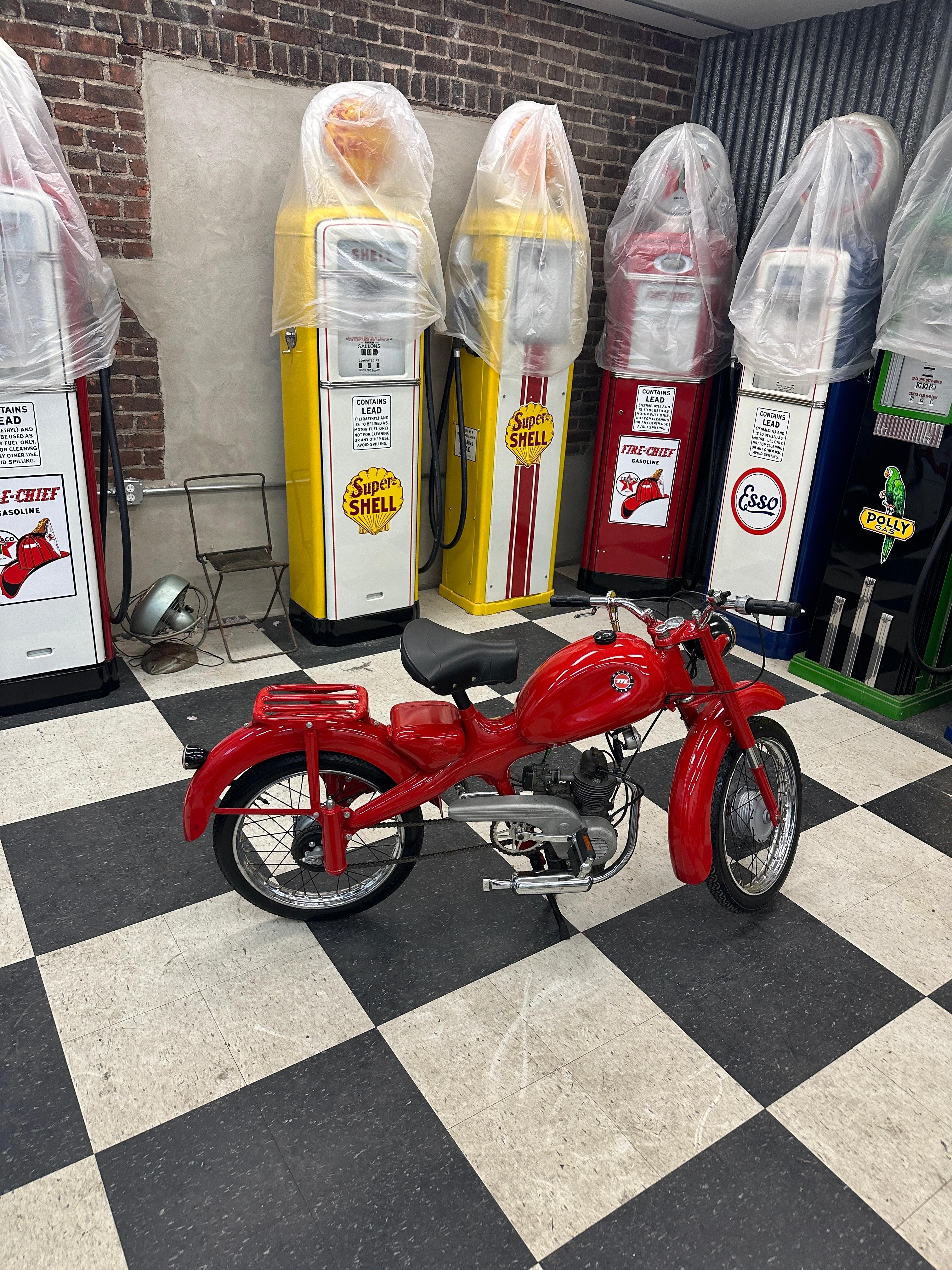 This is a beautifully restored 1961 Moto Morini 