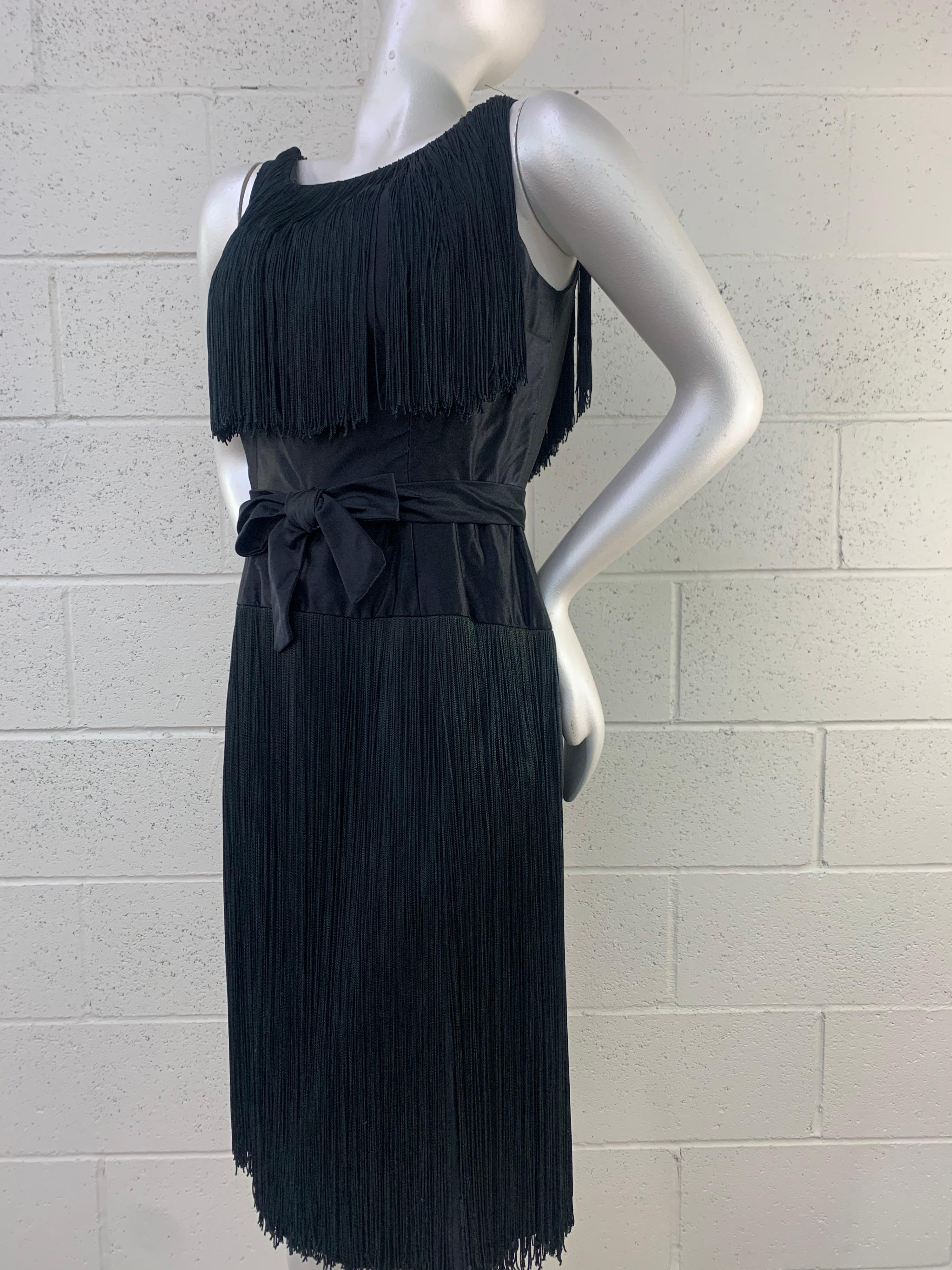 1961 Saks Fifth Avenue Black Satin Sheath Dress w/ Heavy Long Fringe: Smooth silk satin waistline with constructed bow. Made to order through Saks Fifth Avenue. Size 8