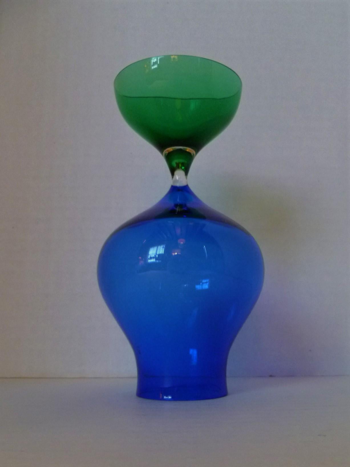Scandinavian Modern Hourglass shaped vessel by Vicke Lindstrand for Kosta in 1962, its form normally associated with Murano glassblowers. With a blue and green color combination, its thin blown glass body makes it very elegant. Able to be used with