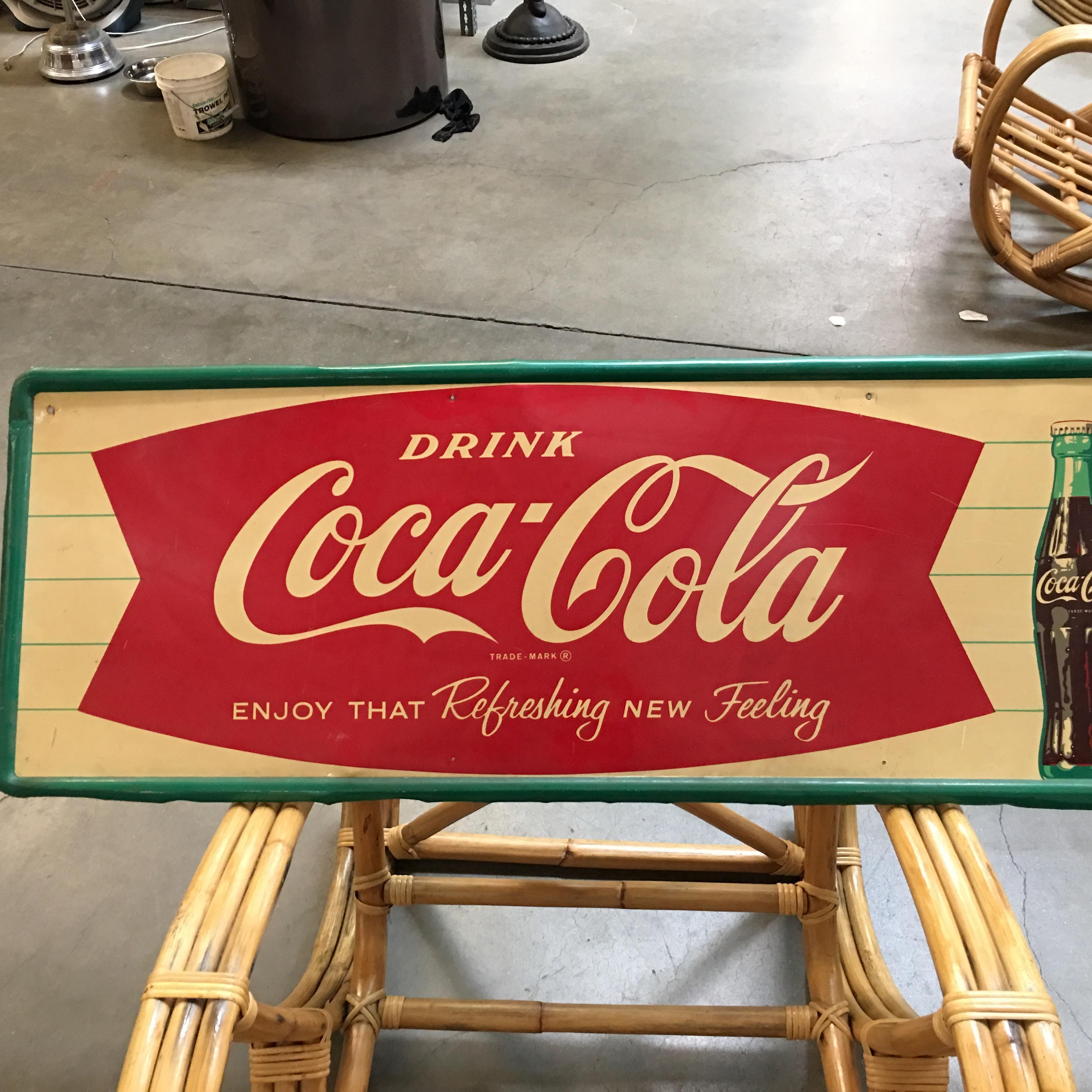 Vintage 1963 Coca-Cola tin advertising sign featuring the fishtail Coca-Cola Logo and an image of a classic Coke bottle with the words 