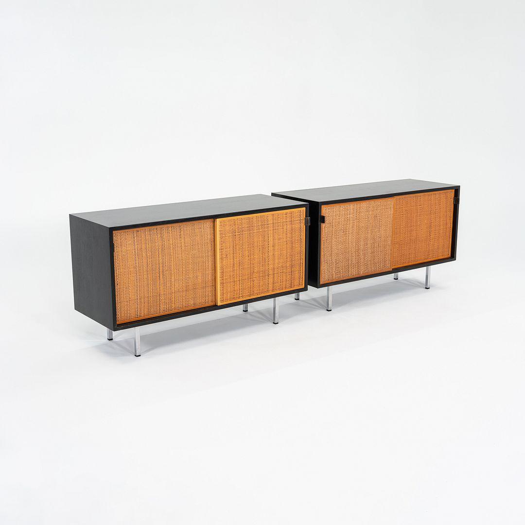 This is a single (two available, but priced individually) Ebonized Walnut Credenza with Caned Sliding Doors and Leather Pulls, designed by Florence Knoll in 1947. The listed price includes one credenza, and we have two available for purchase. Both
