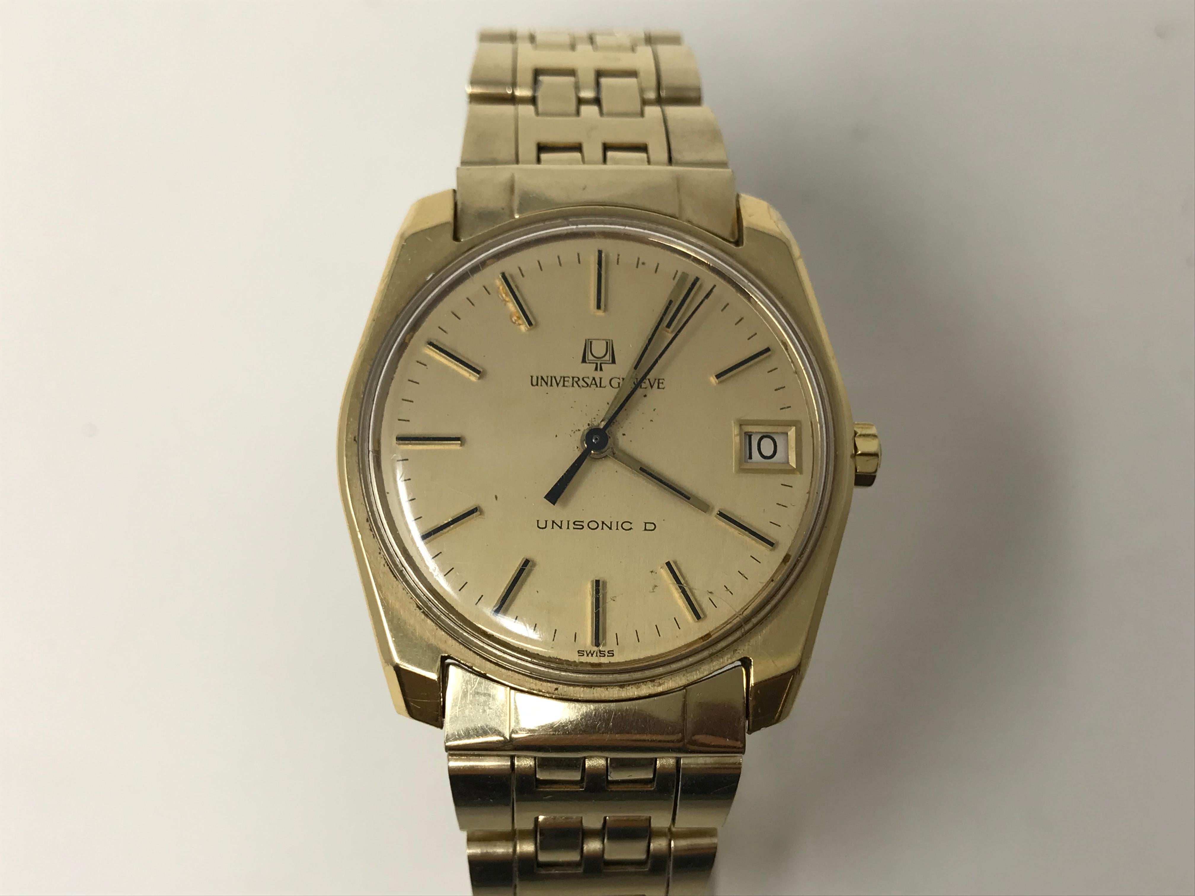 1963 Universal Geneve Unisonic D Watch, made of solid 18k gold and with stainless steel bracelet gold filled in 14k. Gold tone dial and arms , with date, case N. 2618733 marked on the case, woks with an early Electronic caliber. Case measures about