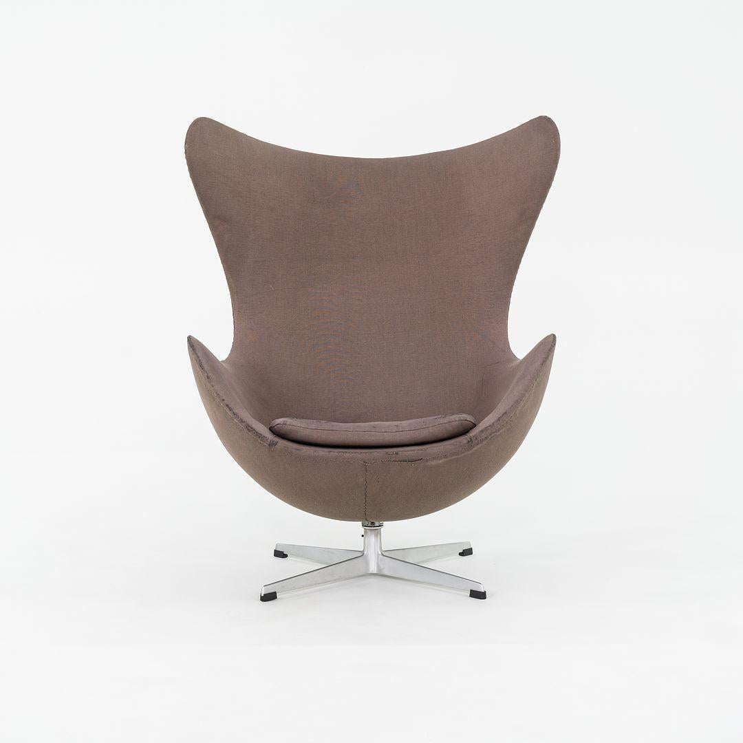 This is an ‚ÄòEgg‚Äô lounge chair and coordinating ottoman, Model 3316, initially designed by Arne Jacobsen for Fritz Hansen in 1958. This set dates to March of 1964 (label shows 0364, indicating production date). Jacobsen perfected this ‚Äúegg‚Äù