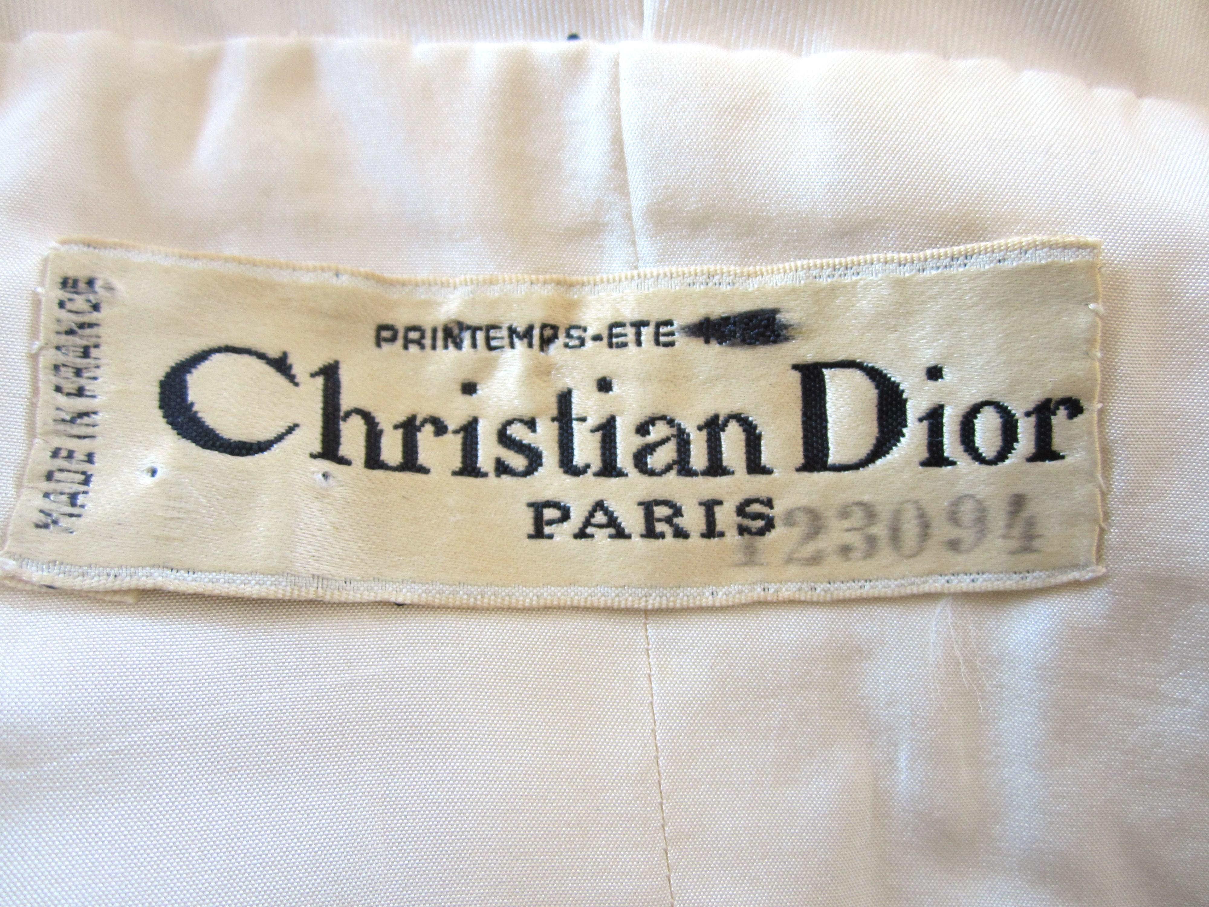 The detailing on this is outstanding! Boned bodice. Christian Dior Printemps- ETE- 1964. Numbered. Silky hand to the fabric. Weighed on the skirt, bodice and jack. Clip and snap closure on the dress. Jacket has a hook and eye and 2 button closure.