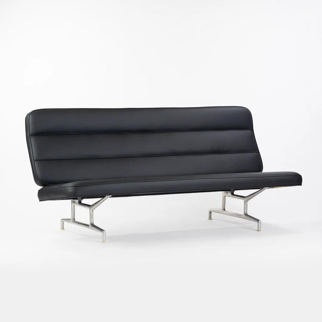 This is a 3473 sofa, originally designed by Charles and Ray Eames for Herman Miller in 1964. It is constructed from aluminum, iron, and plywood. It was recently recovered (2021) in black naugahyde, which was Charles Eames' preferred material for