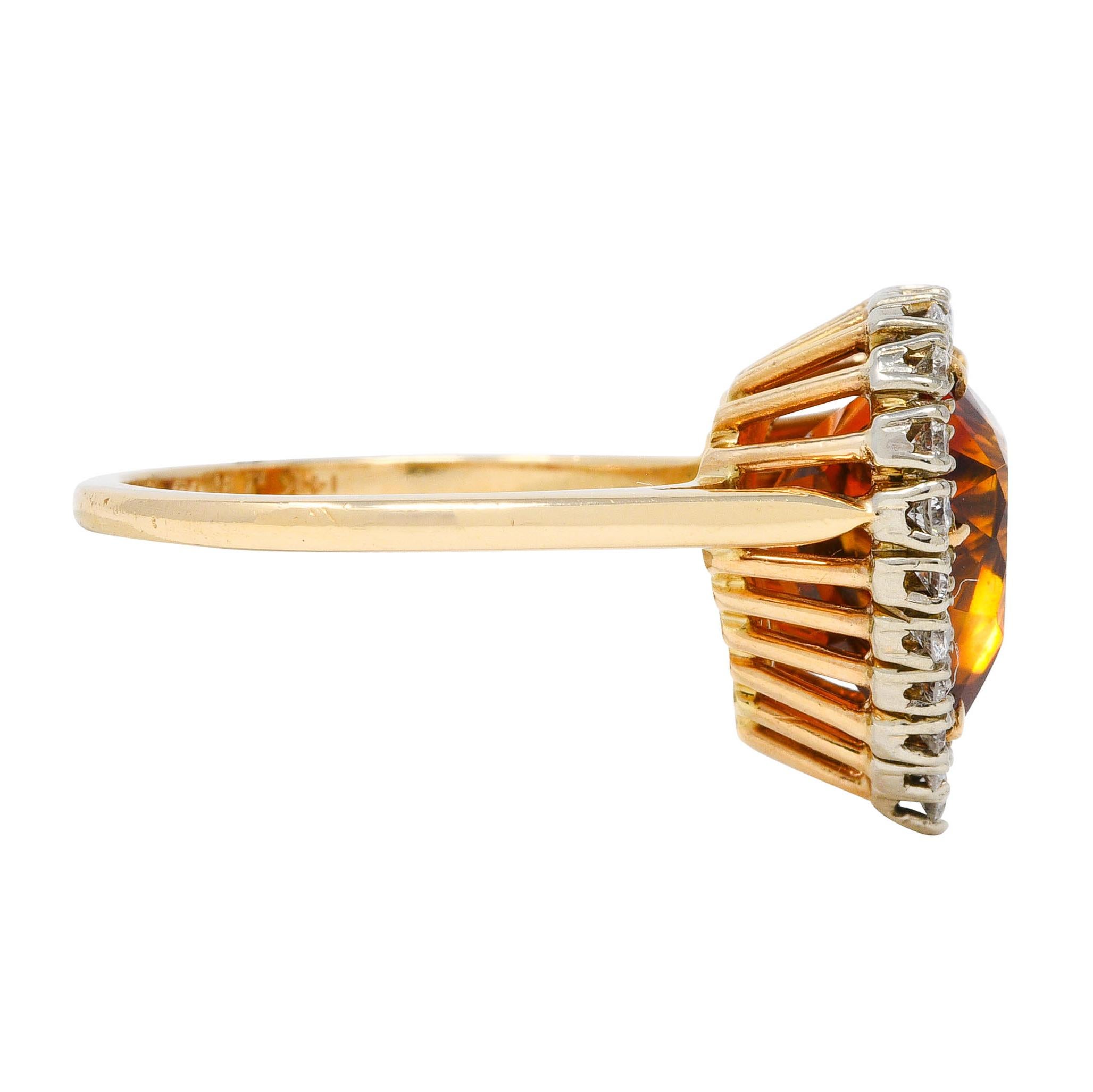Cluster style ring designed as a heart shape centering a prong set 12.0 x 12.0 mm citrine
Citrine is medium in saturation brownish-orange in color
Surrounded by white gold prong set diamond halo, totaling approximately 0.50 carat 
Diamonds are G/H