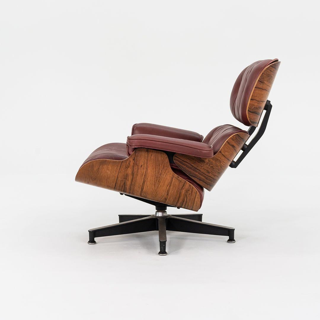This is an original Eames Lounge Chair and Ottoman, models 670 and 671, designed by Charles and Ray Eames for Herman Miller in 1956. This set dates to 1964. The shells on this set are composed of Brazilian Rosewood, and the upholstery is in a smooth