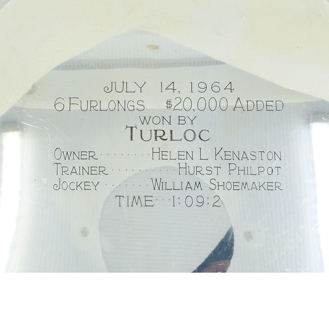 Sterling Silver Trophy Plate by Shreve & Co., San Francisco, commemorating the 1964 Lakes and Flowers Handicap at Hollywood Park, won by Turloc under jockey William Shoemaker. A significant piece of American horse racing history. The winning jockey,