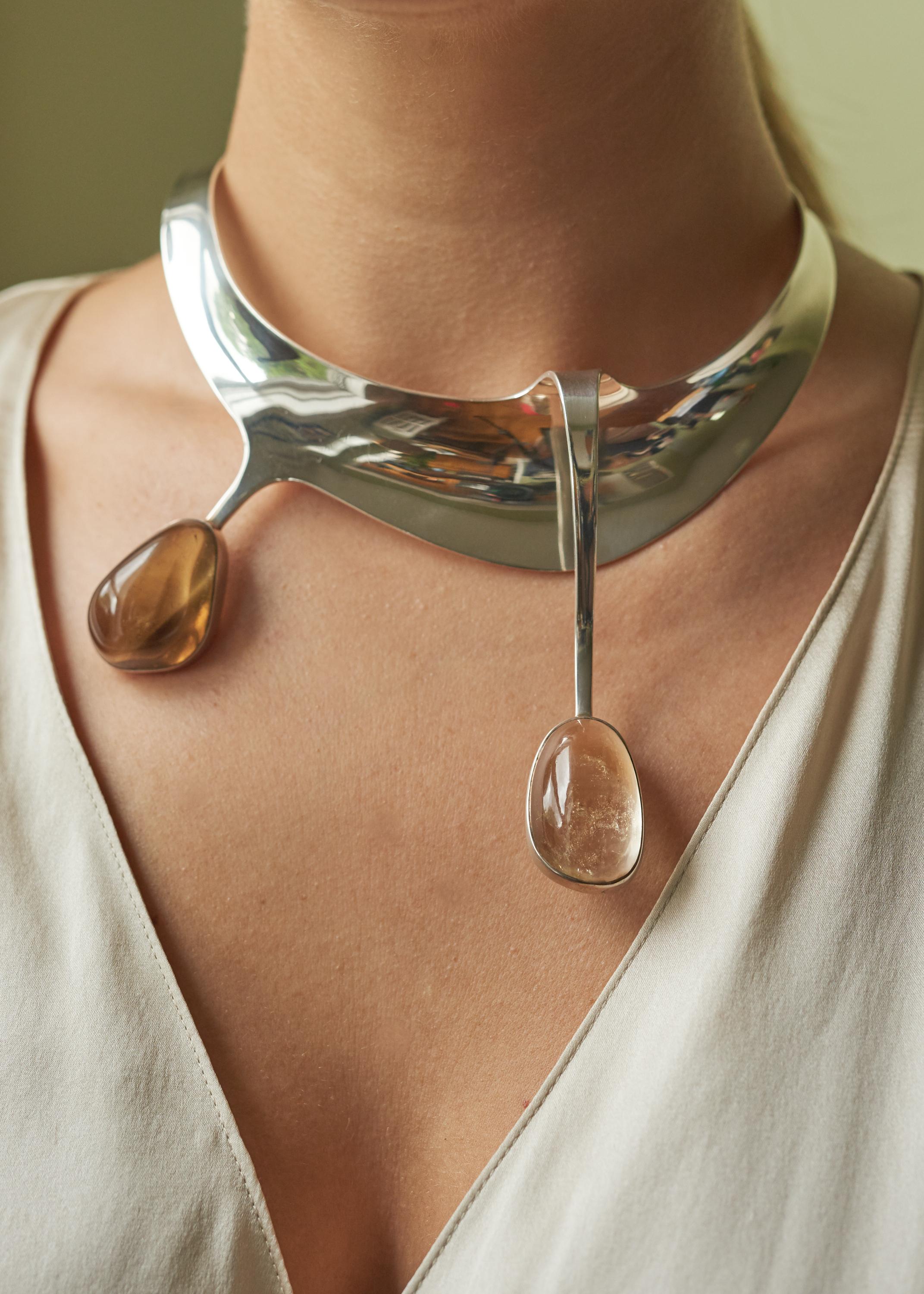 An early, smoky quartz, rock crystal and sterling silver collar, by Theresia Hvorslev, 1964.

The entire length of the collar is 15