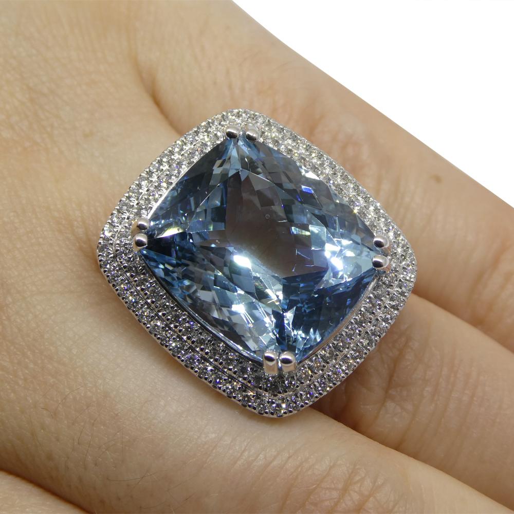  

Dive into the enchanting depths of our Cushion-Cut Aquamarine and Diamond Ring, a symphony of elegance and sophistication. At its core shines a mesmerizing cushion-cut aquamarine, an awe-inspiring 19.64 carats. This aquamarine, celebrated for its