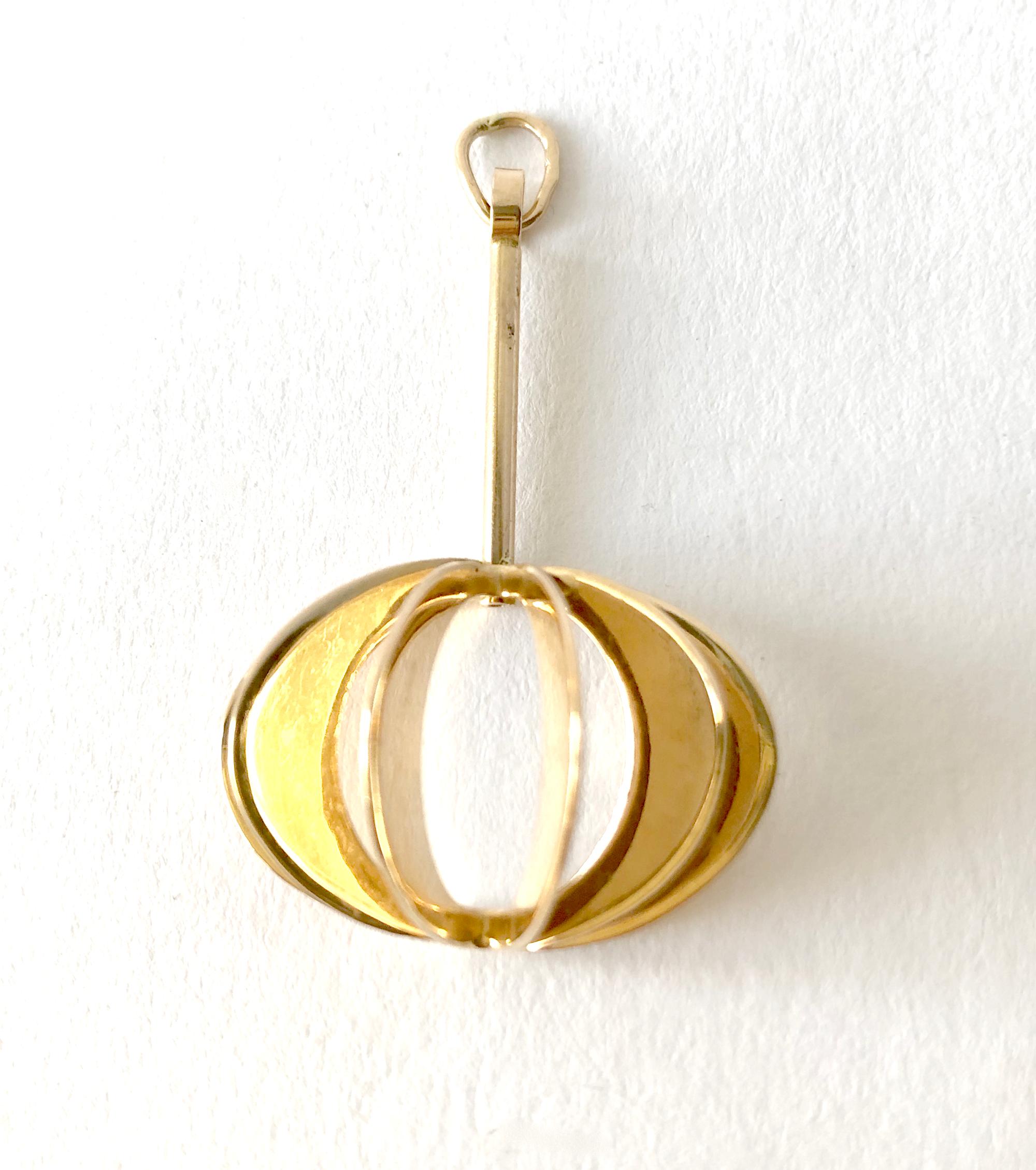An 18 karat gold pendant designed by goldsmith Theresia Hvorslev of Stockholm, Sweden.  Pendant measures 1.5