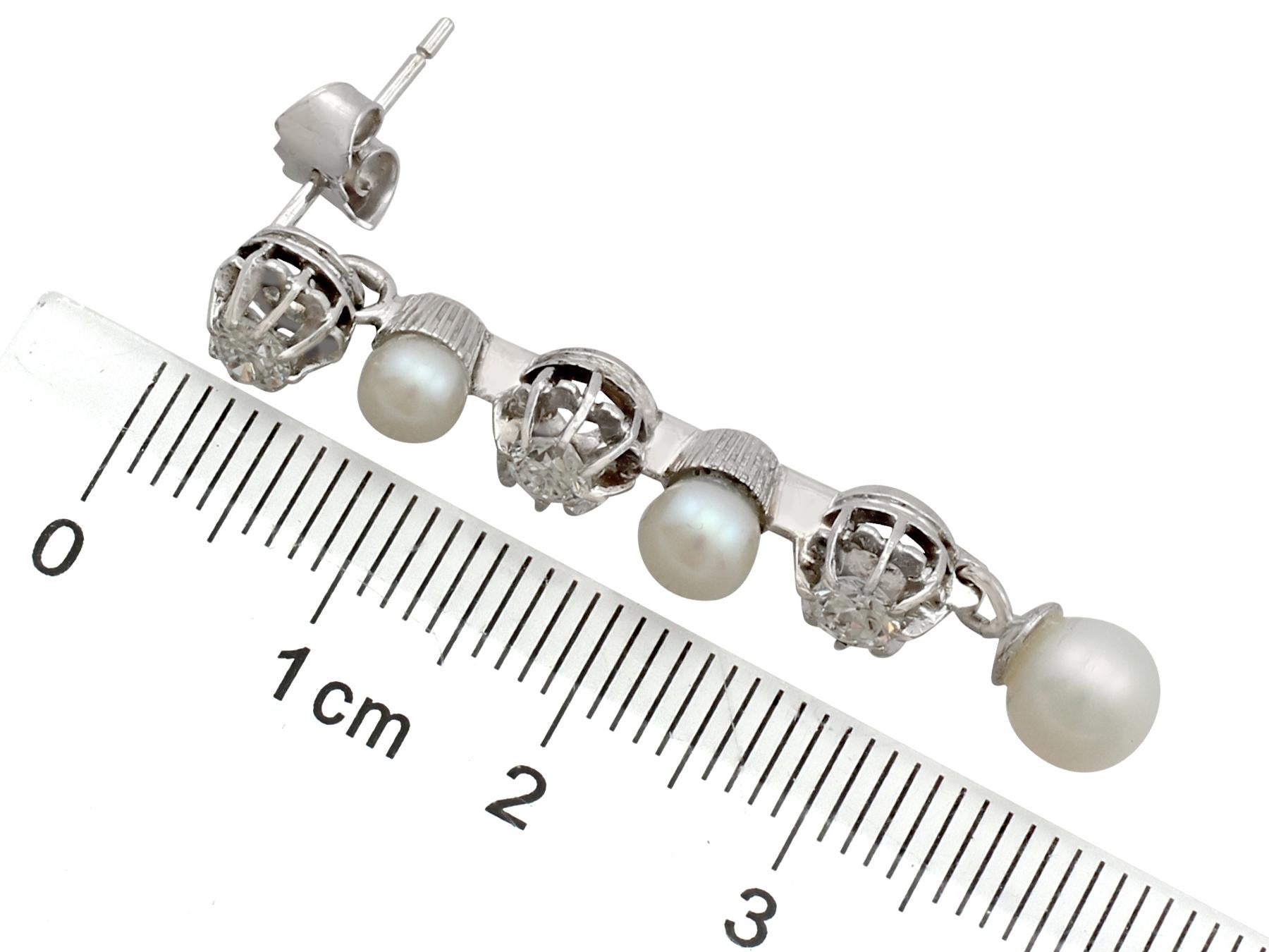 Round Cut 1965 Cultured Pearl and 1.09 Carat Diamond White Gold Drop Earrings