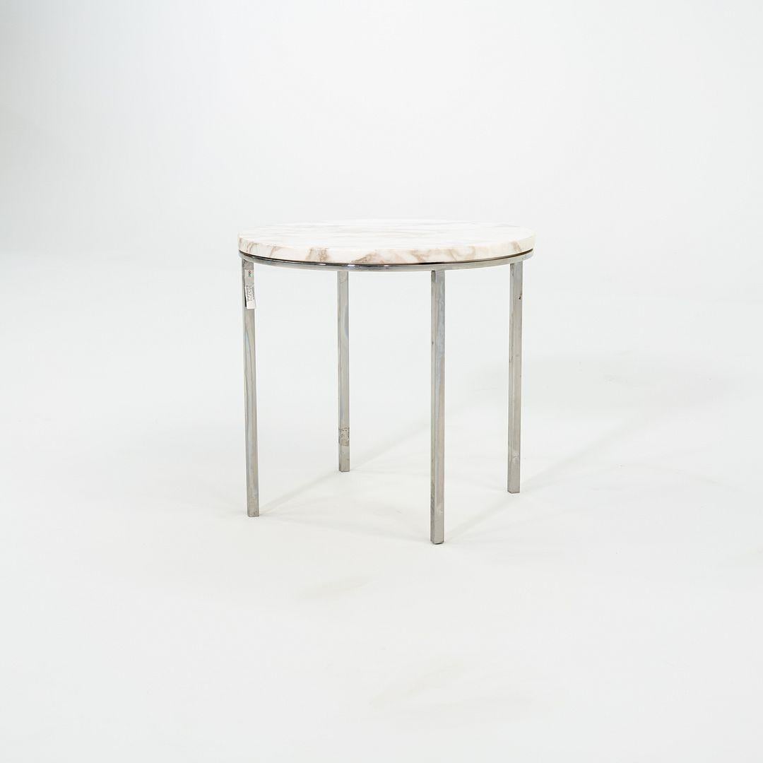 This is a sophisticated marble and stainless steel side table, Model TA-39, designed by Davis Allen and Gordon Bunshaft of SOM. Skidmore, Owings & Merrill is a hugely important architectural firm. They produced hundreds of their own furniture