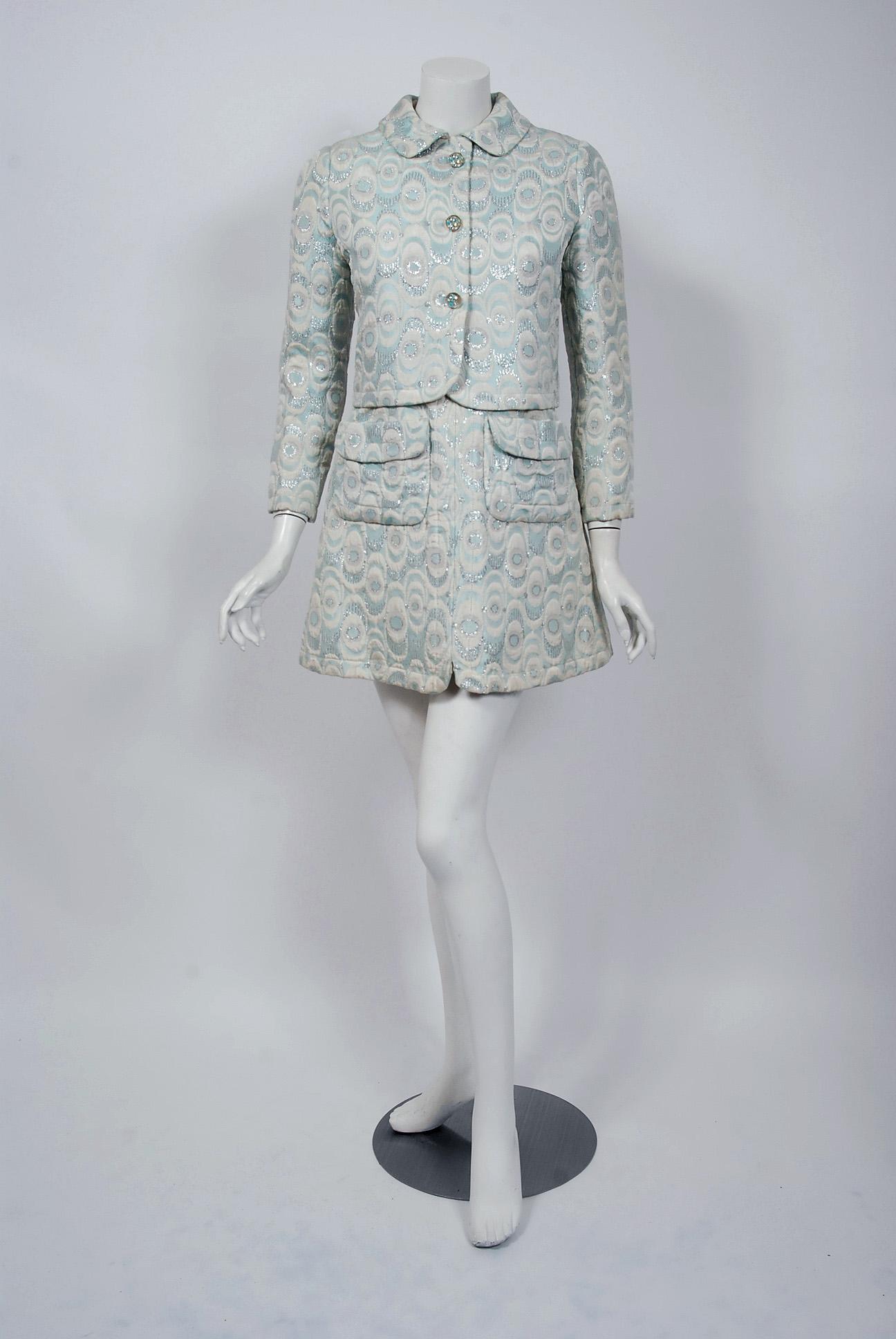Gorgeous Jean Patou by Michel Goma Paris boutique ensemble dating back to the mid 1960's. This rare dress and jacket read so fresh and modern. The fabric alone is a masterpiece; rich fully-lined metallic light-blue, silver and ivory silk brocade in