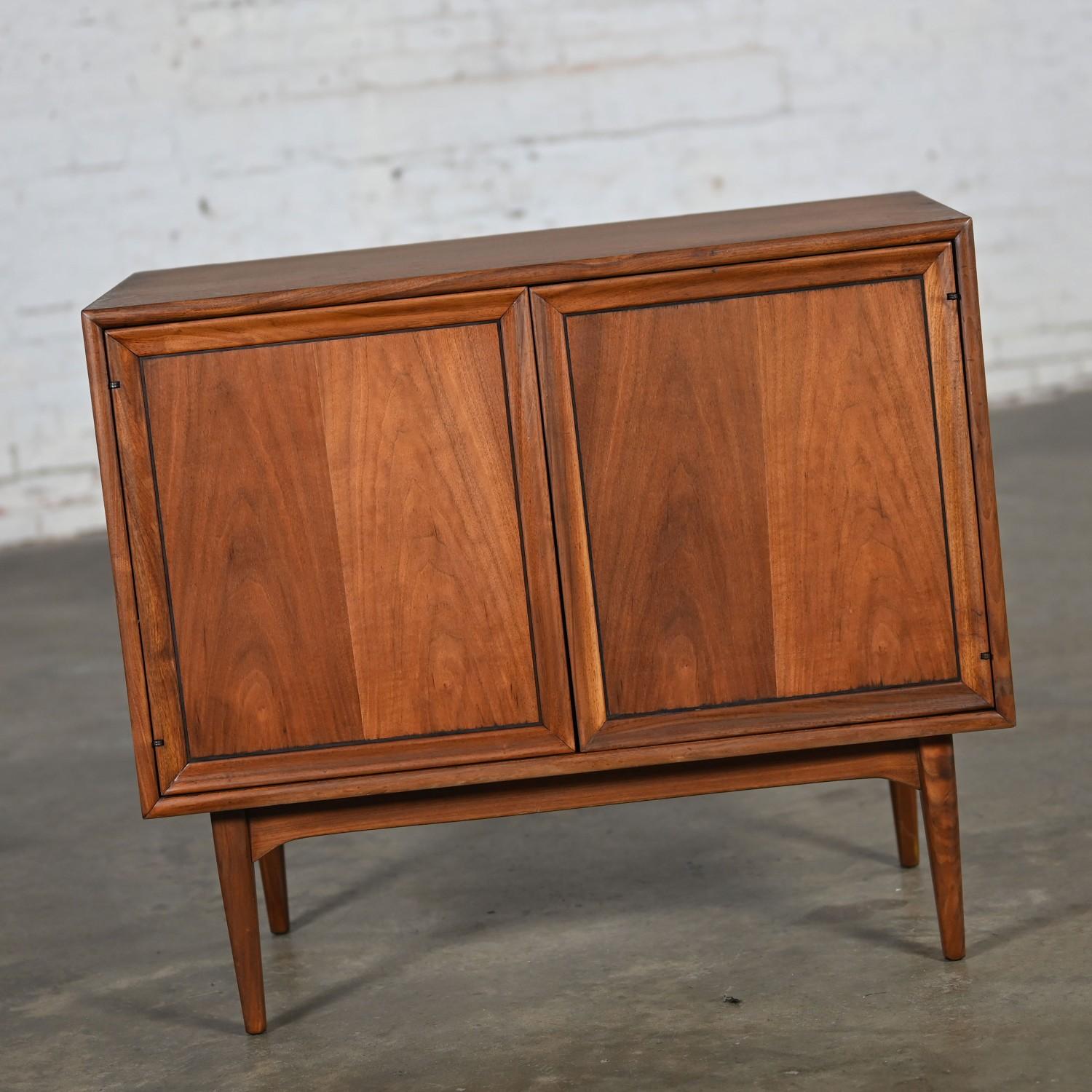 Handsome vintage Mid-Century Modern Drexel Declaration walnut record cabinet by Kipp Stewart & Stewart MacDougall. Beautiful condition, keeping in mind that this is vintage and not new so will have signs of use and wear even if it has been