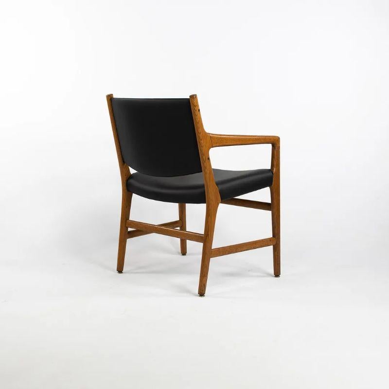 Listed for sale is a pair of JH 507 dining chair with arms, designed by Hans Wegner, produced by Johannes Hansen. This pair of chairs came from Harvard University and is accompanied by thorough documentation showing the chairs in the original