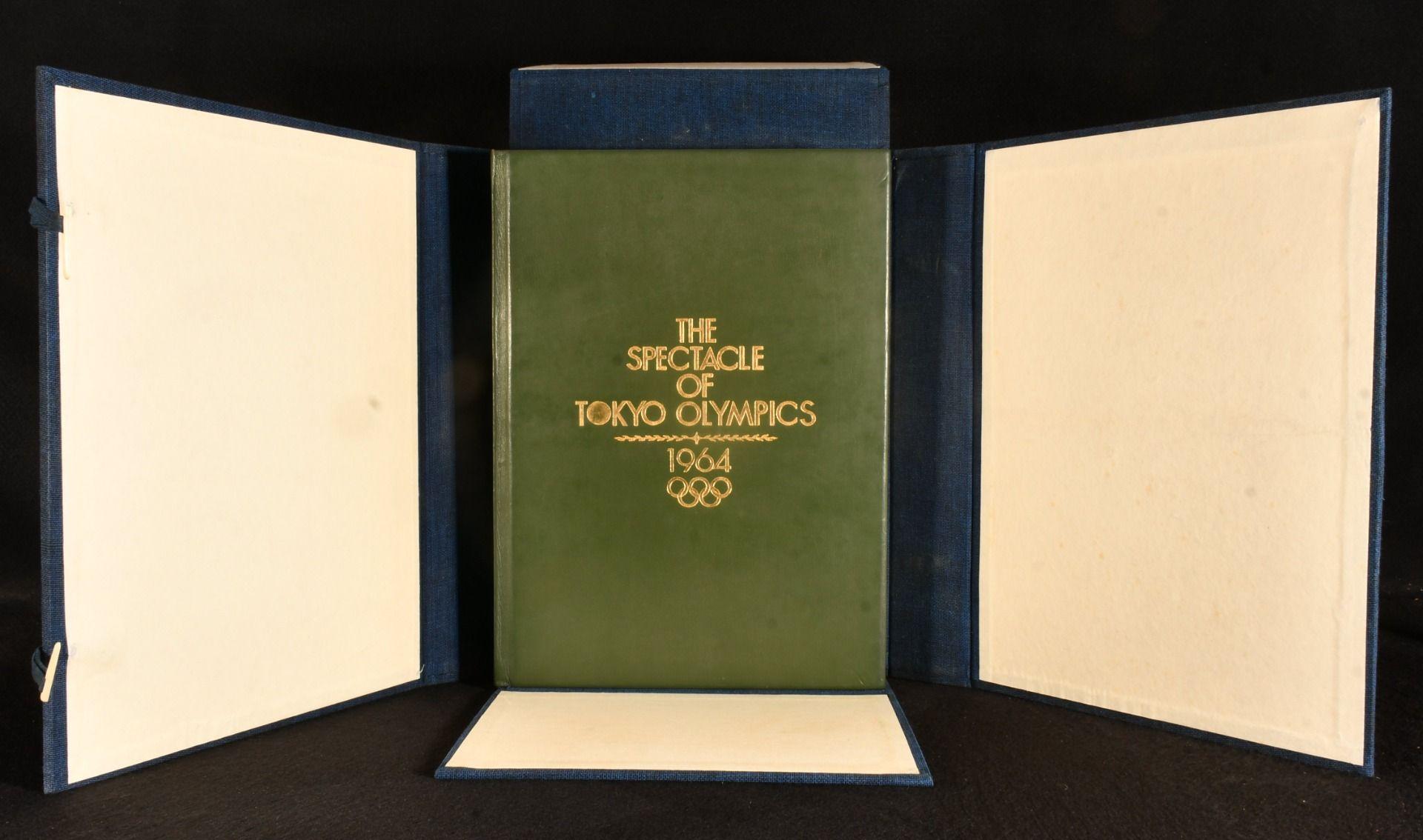 A very scarce beautiful first edition volume commemorating the 1964 Tokyo Summer Olympics, vividly illustrated in colour and monochrome throughout.

A very scarce first edition.

In the original cloth solander box, in a near fine