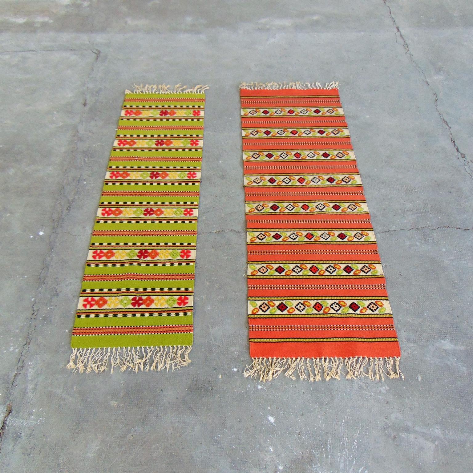 These two Kilim handwoven carpets came to Italy in 1970, destined to a seashore home near Portofino. They are colorful and show a regular and precise weaving.
One has a warm orange tone and measures cm 178 x 62 (5' 10'' 5/64 x 2' 13/32
The green one