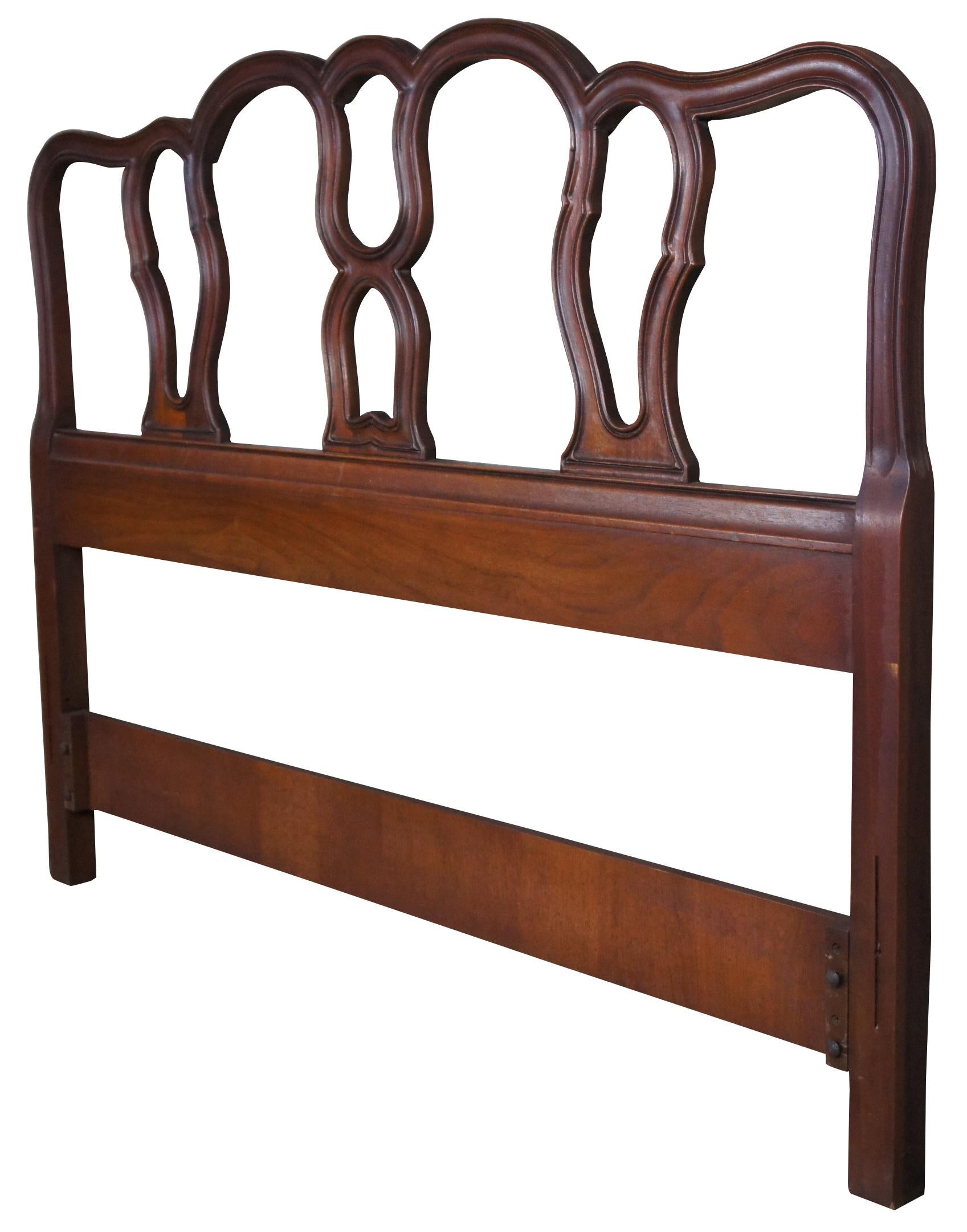 1966 mid century Drexel Bordeaux French Provincial full size bed headboard. Made from walnut with a serpentine form and pierced back. 206-540. Measure: 57
