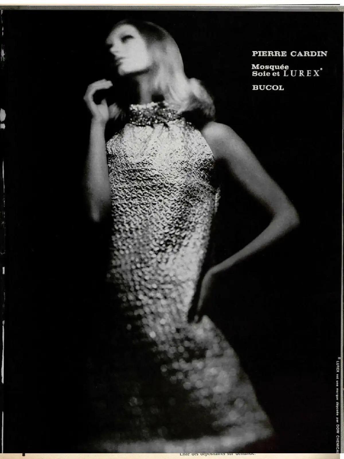 A totally iconic and highly collectable Pierre Cardin metallic silver beaded and sequin mod mini dress dating back to his 1966 fall-winter collection. Cardin is known for his avant-garde style and his unique geometric shapes, often ignoring the