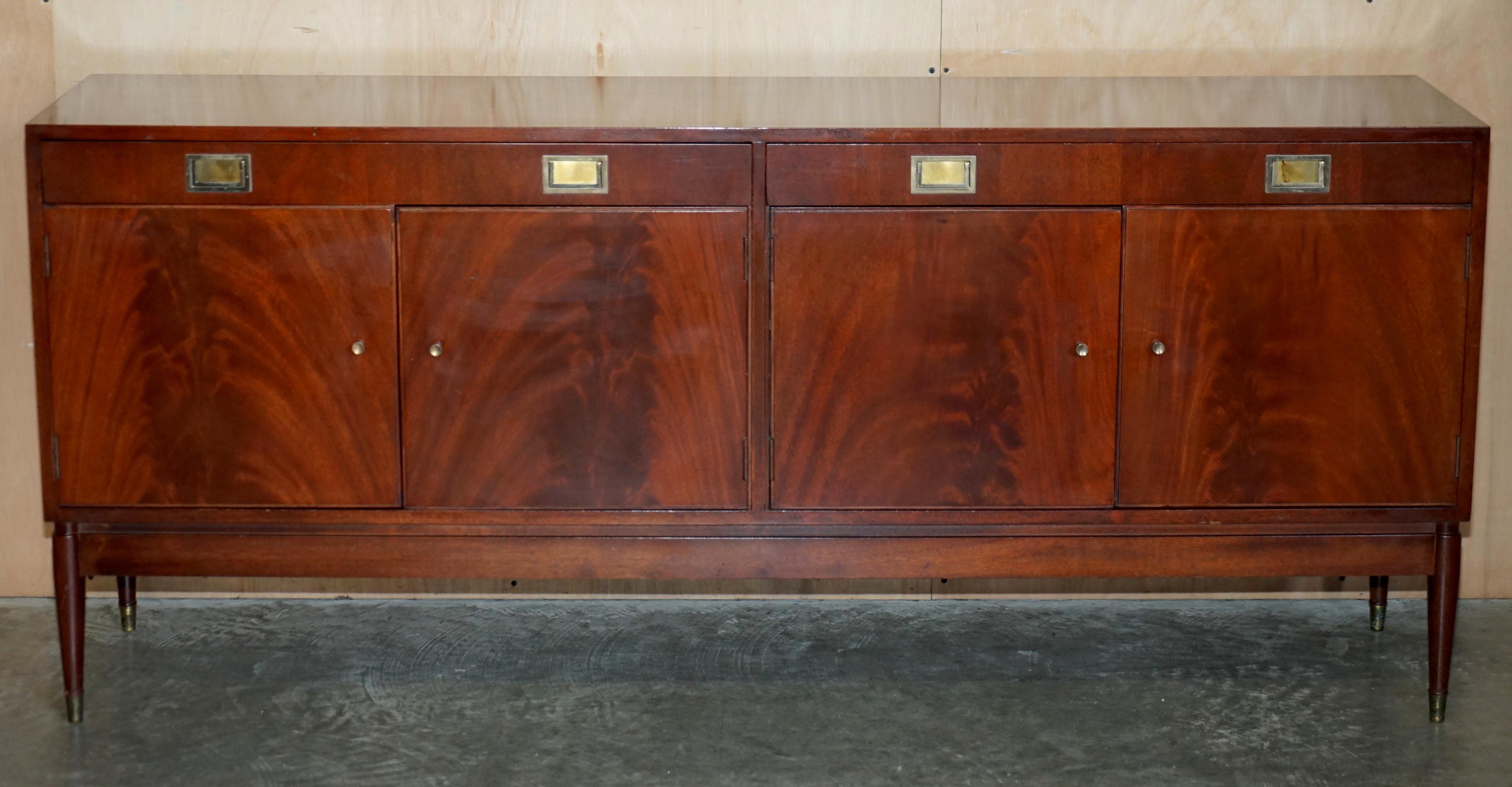 We are delighted to offer for sale this stunning original 15th June 1966 stamped Greaves & Thomas flamed mahogany with campaign handles sideboard model number 5213.

A very good looking well made and decorative piece of Mid Century Modern