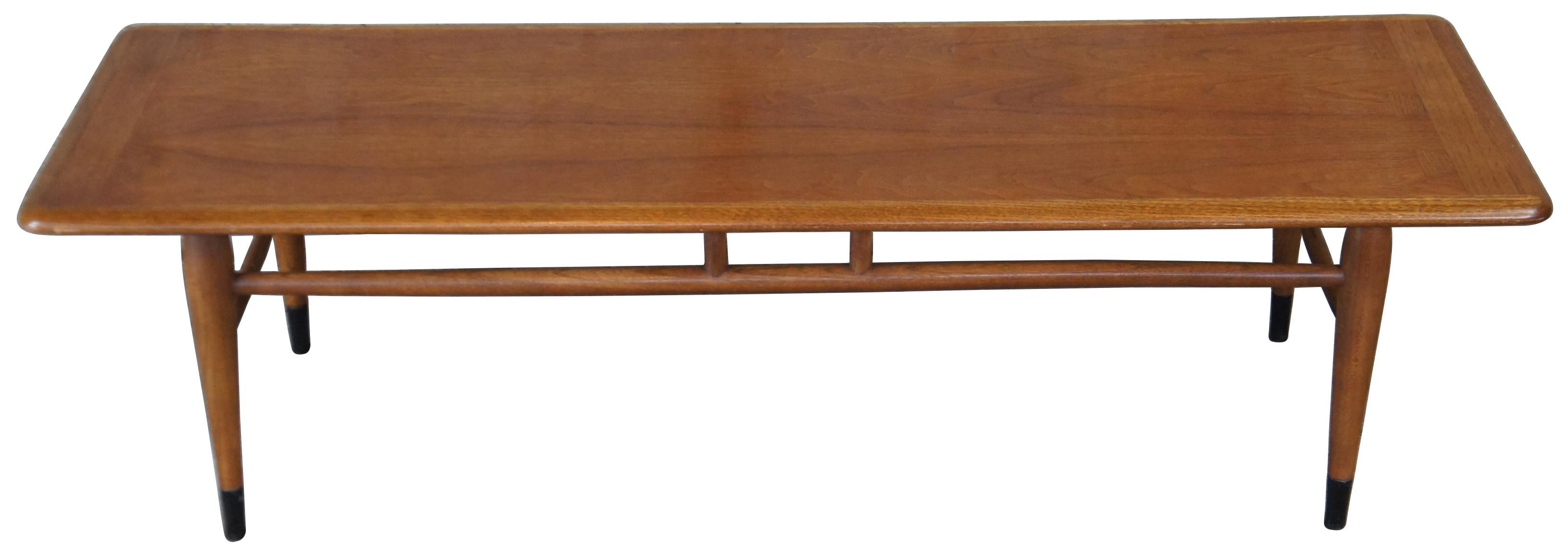 Circa 1966 Lane series 900-0 Acclaim coffee table. A rectangular form made from walnut with a two tone top featuring tongue and groove design. 
 