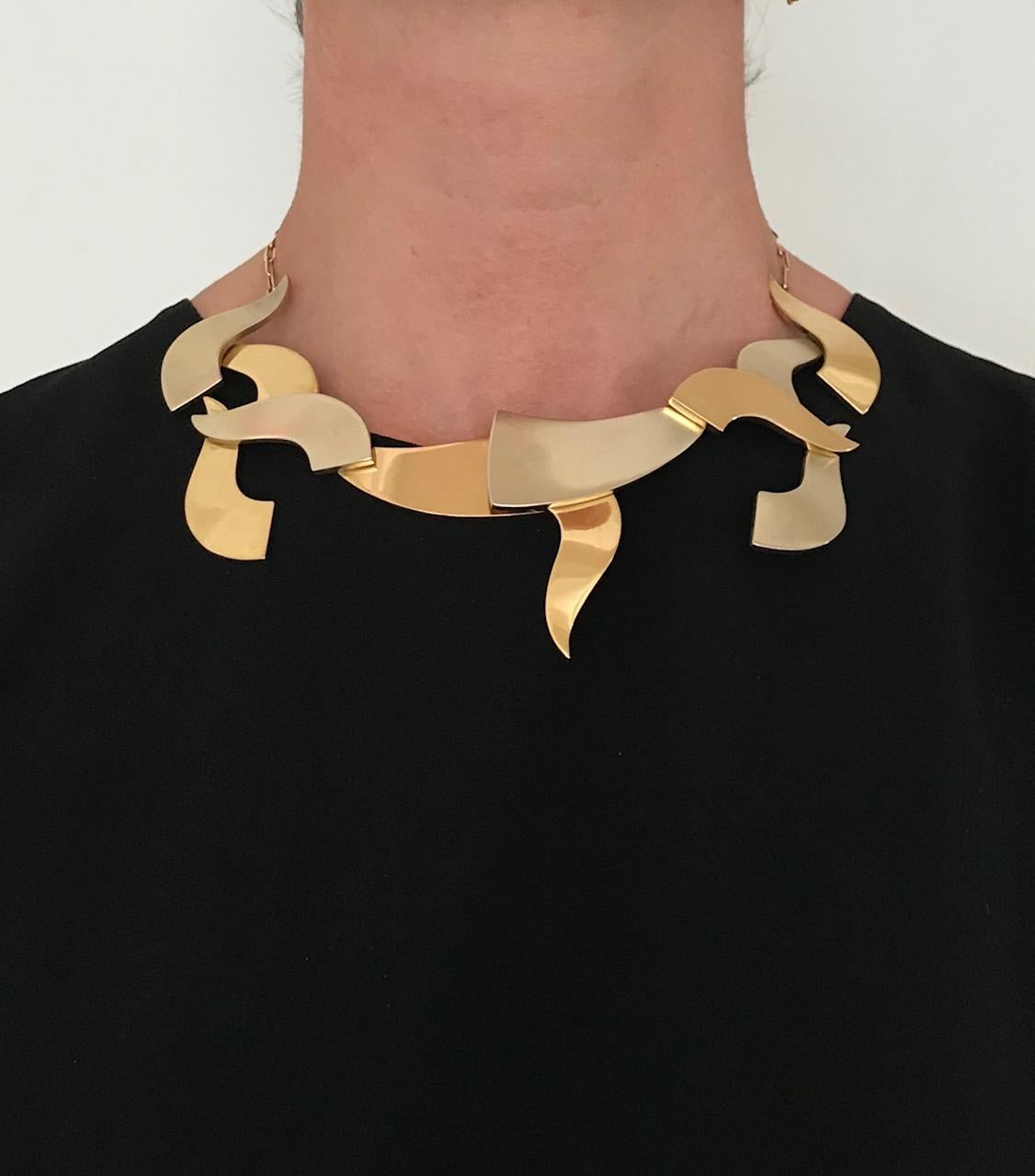 An 18 karat white and yellow gold articulated collar, by Hans Richter was made in 1967.

This sculptural necklace is marked Hans Richter, 67, no. 5/9. A necklace of this design was exhibited in Jewelry as Sculpture as Jewelry, at the Institute of