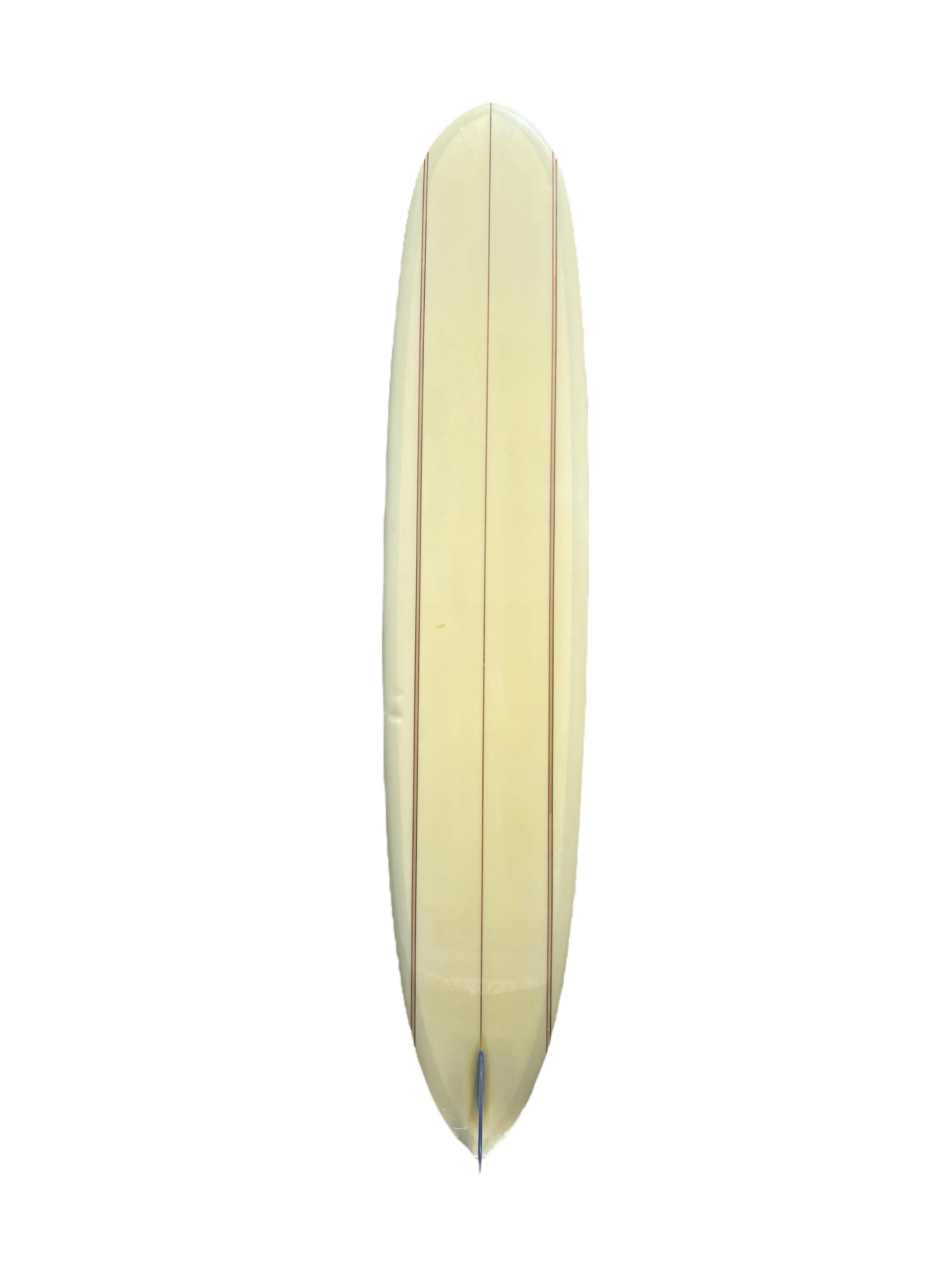 1967 replica Bing Surfboards Dick Brewer Pipeliner surfboard #1 of 100. Shaped by Dan Bendiksen. Features 7 wood stringers and a pintail shape with blue fixed single fin. A tribute surfboard made to Dick Brewer’s exact specifications of his original