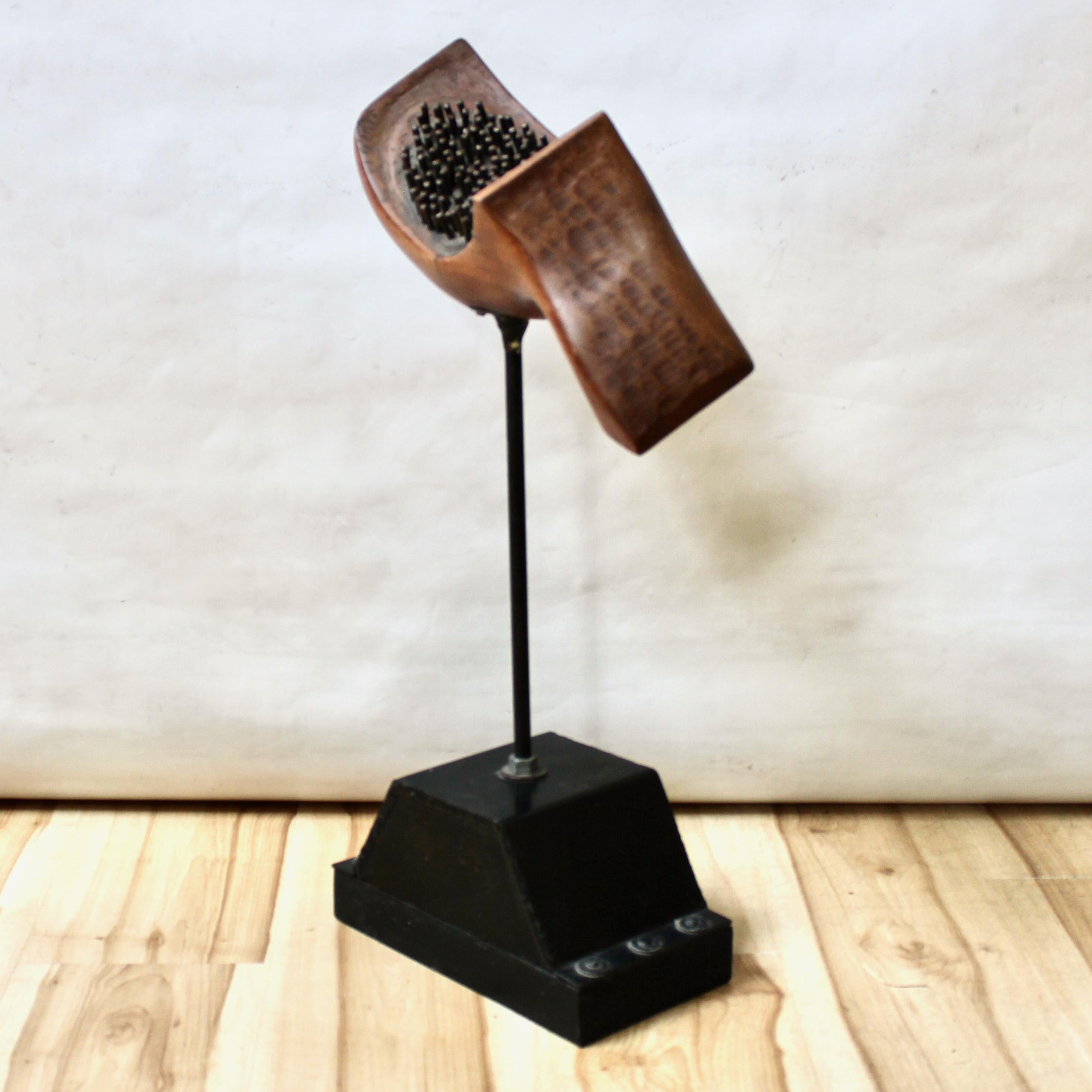 1967 Industrial sculpture by California artist Ronald Dee Sullivan. The sculpture consists of a wooden head with metal details, mounted on an industrial metal stand. In excellent vintage condition, signed on the underside.

Width: 15 in / Depth: