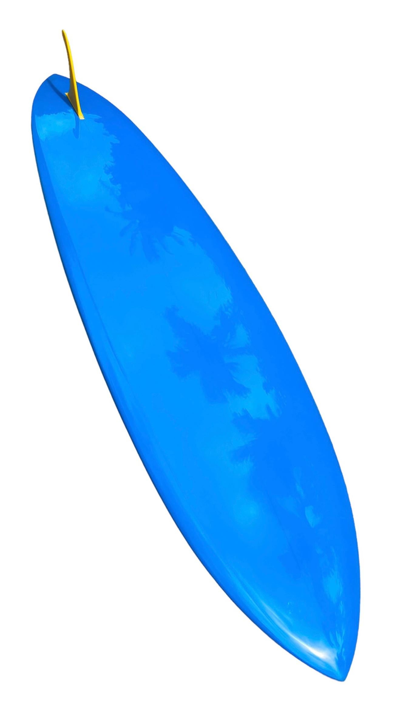 1967 Vintage Hansen pintail Mini Gun surfboard. Features sky blue inset, blue opaque bottom with wrap-around rails, and clear foam center “spear”. Blue and black double pinstripes with Hansen’s removable fin system and yellow Hansen single fin. A