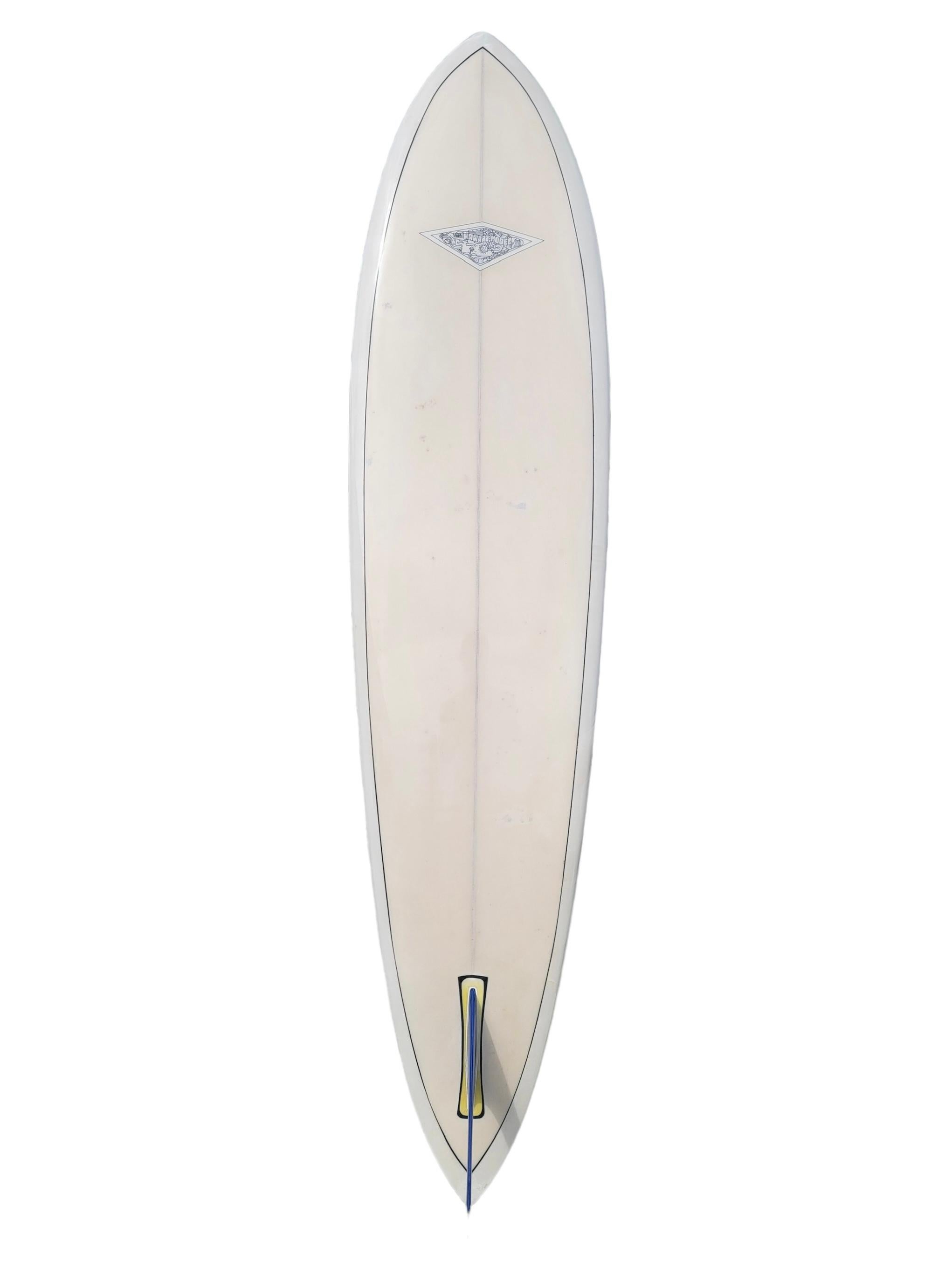 Vintage 1967 Hobie Hawaii model surfboard. Features a pintail shape design with white pigment and bright blue pinstriping. Very low production Hobie Hawaii model logo. As seen in “The Ultimate Guide to Vintage Surfboards & Collectibles” hardcover