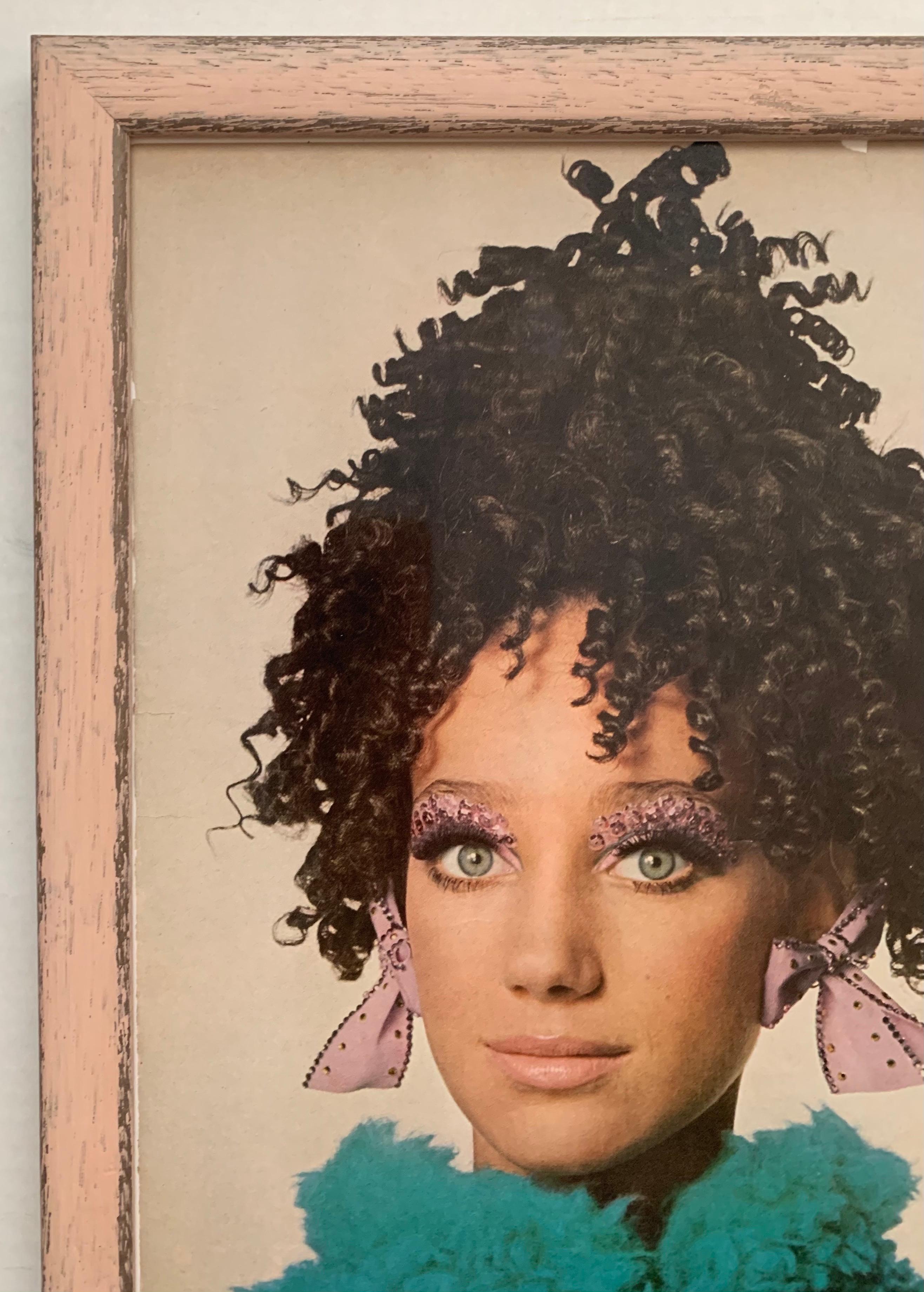 Vogue Magazine 1967 fashion editorial framed page. Marisa Berenson photographed by Irving Penn. 
As found framed condition in pink wooden frame with lightly antiqued finish. 
“Marisa Berenson is wearing a clutch of corkscrew ringlet hairpieces set