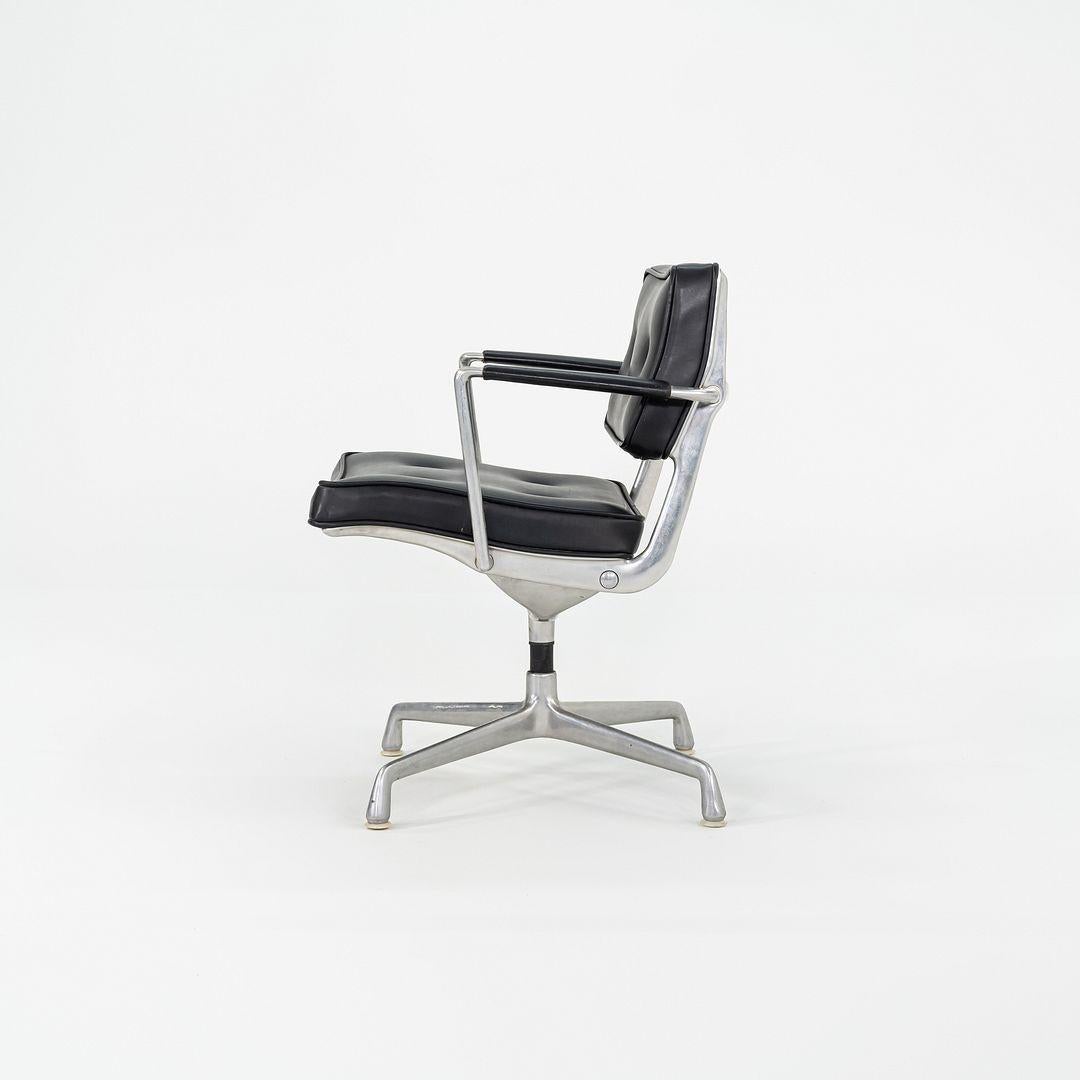 This is an Eames Intermediate Desk Chair, Model ES102, designed by Ray and Charles Eames for Herman Miller in 1968. This early example dates to around that same time period. This example has black Naugahyde upholstery and has a universal Eames