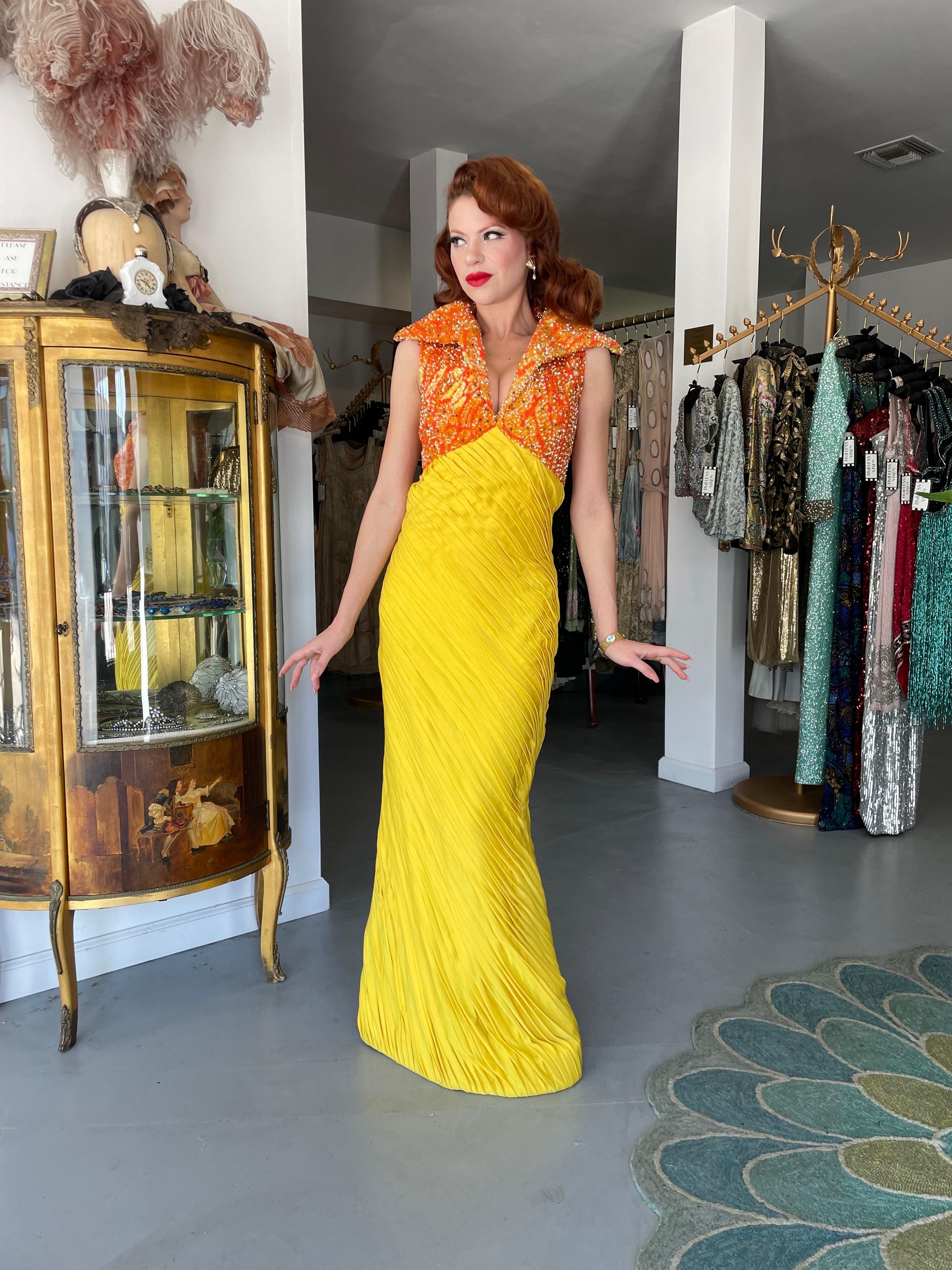 An absolutely breathtaking and ultra rare La Mendola Italian couture vibrant yellow pleated silk jersey beaded glamour gown dating back to their 1968 spring/summer collection. Though their work has only recently begun to be appreciated, Mike La
