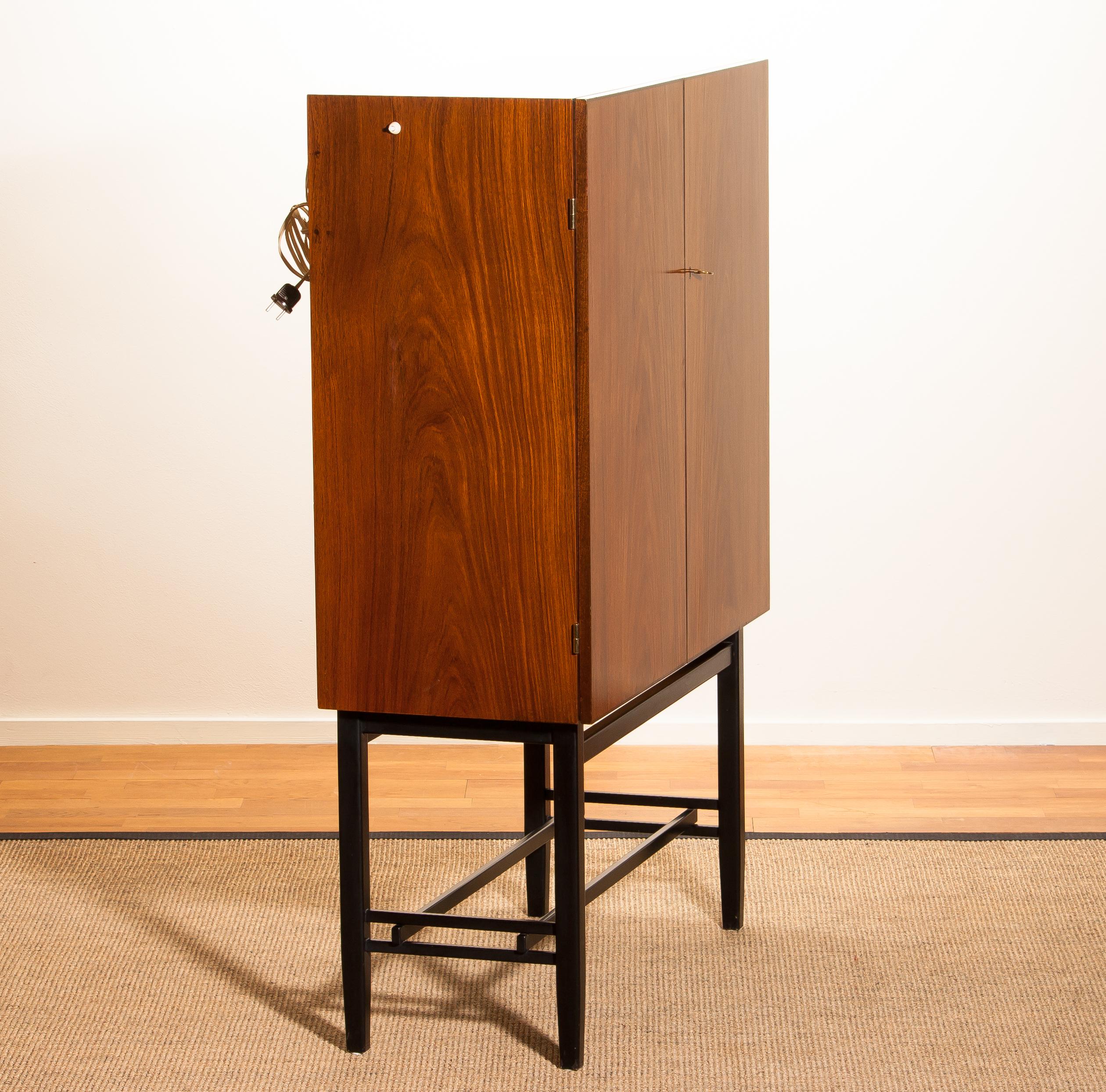 Mid-Century Modern 1968, Mahogany and Brass Dry Bar Cabinet High Black Skinny Legs by Förenade