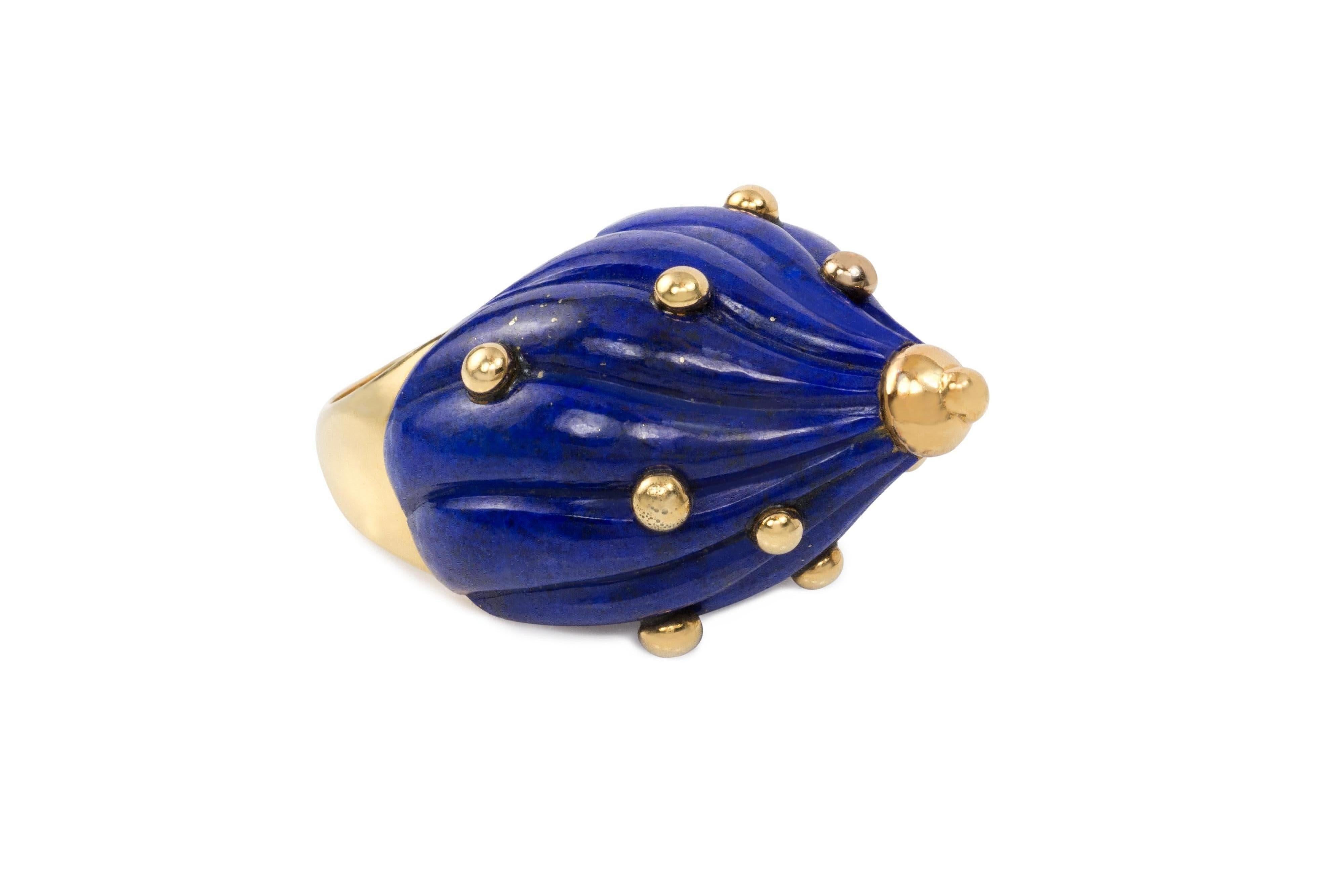 A hand carved, unique lapis lazuli and 18 karat gold dome ring, by British jewelry artist E.J. Shewry, 1968. Ring size is 7.75  London hallmarks with the letter 