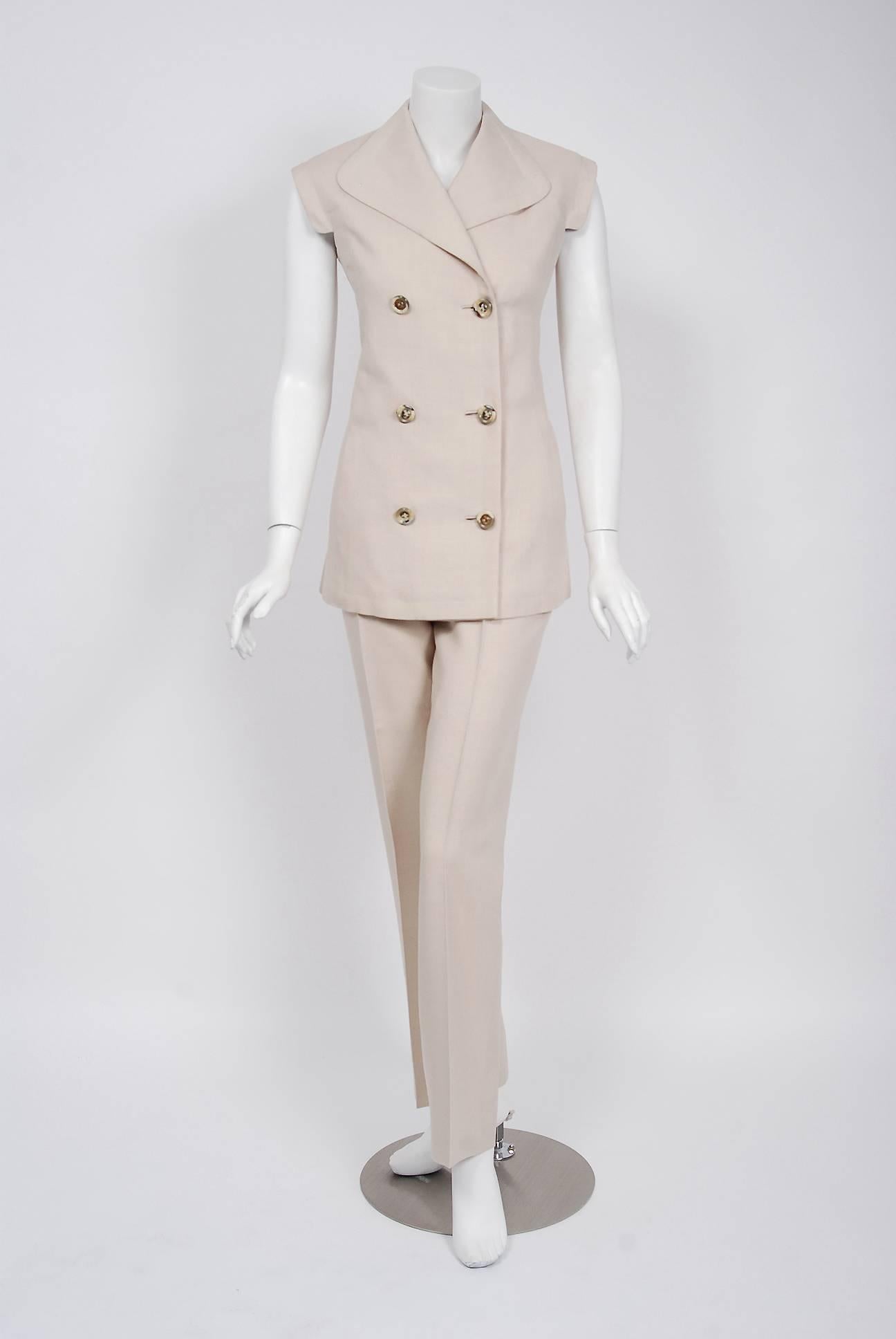 Spectacular Pierre Cardin oatmeal linen pantsuit from his 1968 collection. In 1951 Cardin opened his own couture house and by 1957, he started a ready-to-wear line; a bold move for a French couturier at the time. The look most associated with Cardin