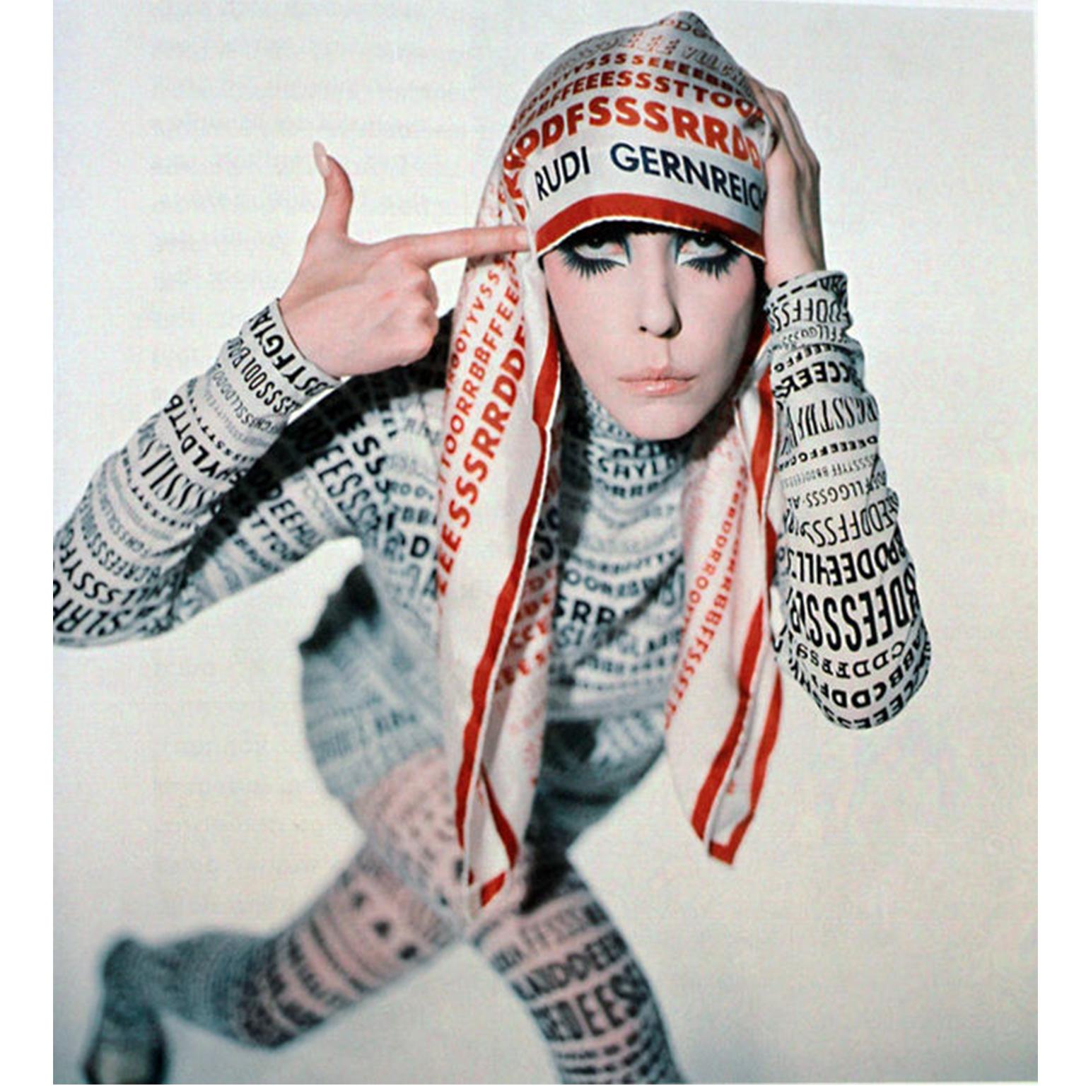 This is a rare vintage 1968 silk alphabet scarf designed by Rudi Gernreich and a different one from the same collection was modeled by Peggy Moffitt in one of her more iconic photos. The scarf has rows of different fonts in blue and one row in dark