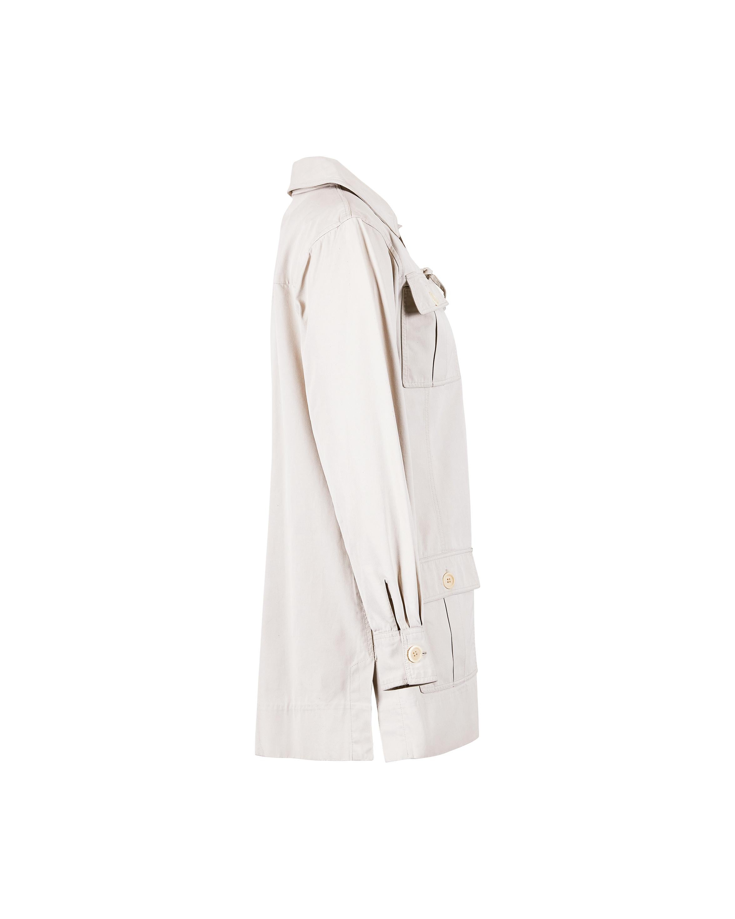 Iconic and super rare Yves Saint Laurent Rive Gauche safari dress from 1968 ‘Safari’ collection. Cream khaki cotton with lace-up front and large buttoned pockets complete the safari motif. Highly documented piece, seen featured on Veruschka von