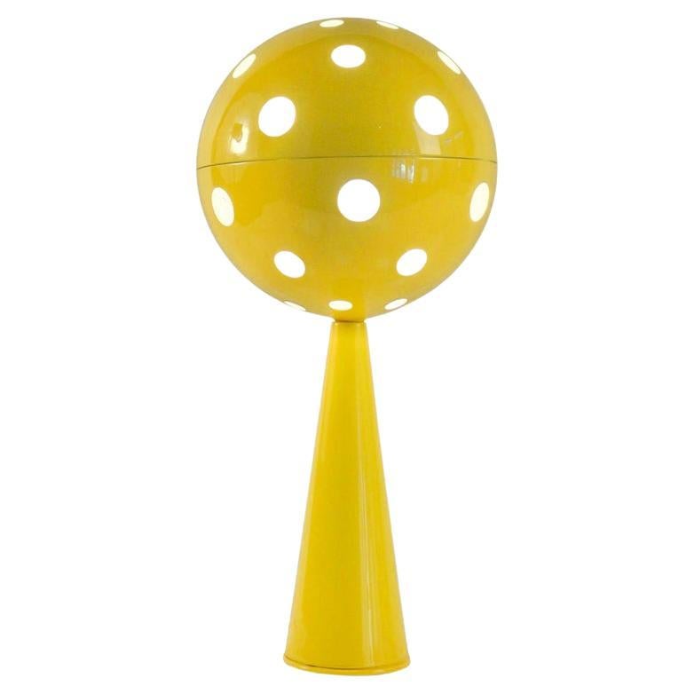 Rare table lamp model Planetary / Planetary by Sabine Charoy.

 The foot of the lamp is conical, it supports a large perforated ball representing the stylized planet, it contains the light source. The light shines through the holes of different