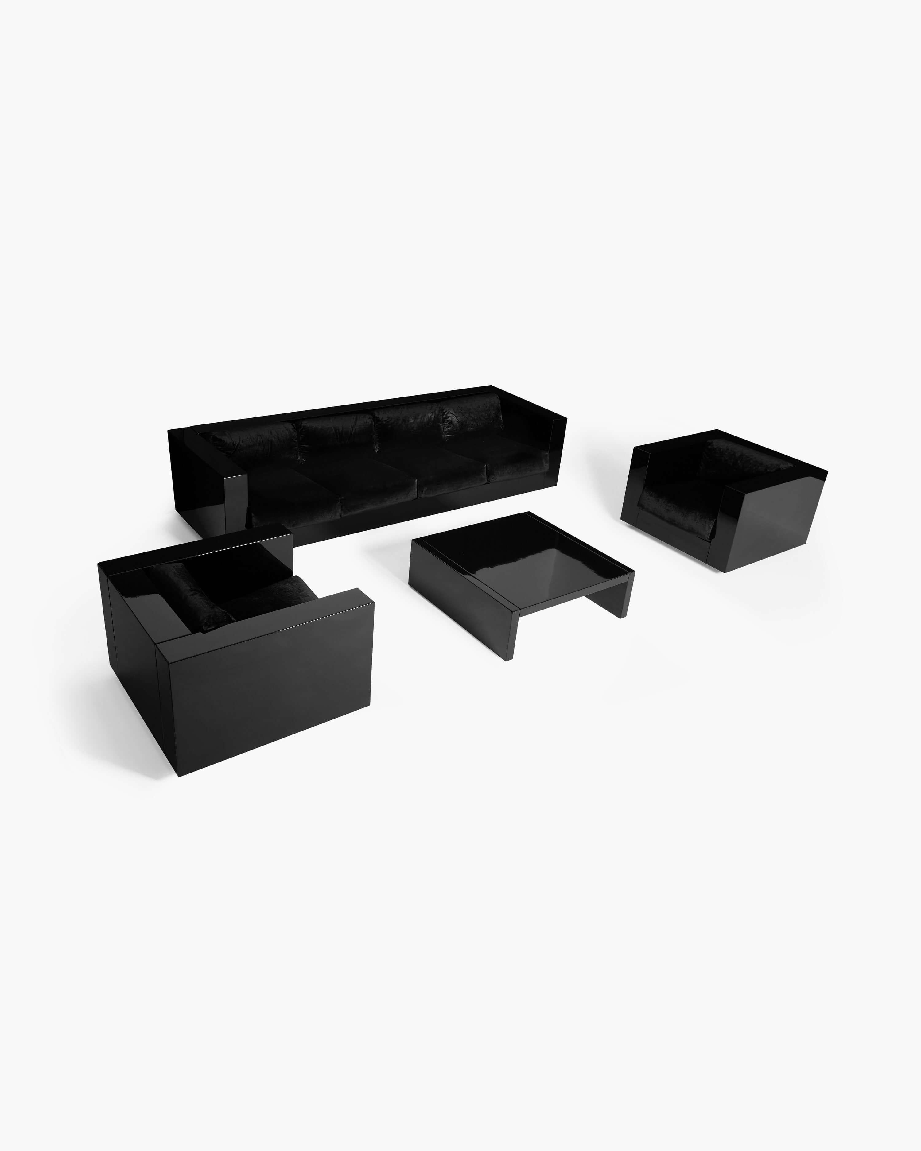 Designed by Italian couple Massimo and Lella Vignelli, this striking Saratoga living set for Poltronova manifests uninhibited cool, its rigid lines juxtaposed against sumptuous lacquered surfaces and velvet upholstery. 

The set includes a prototype