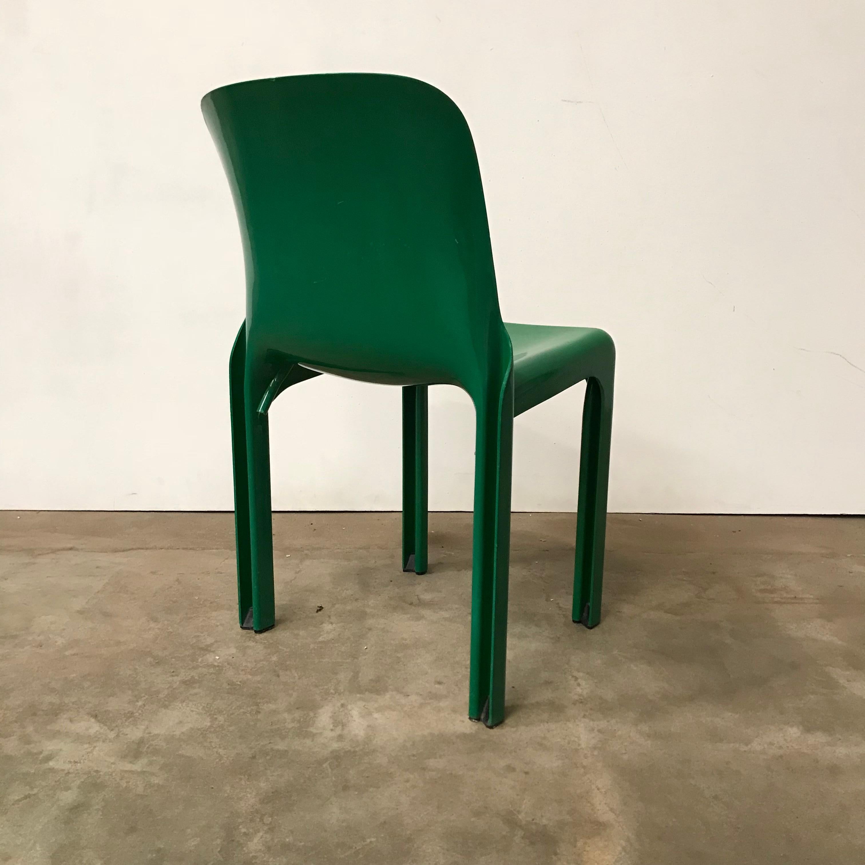 Selene chair in beautiful green. The chair is in good condition except for some small scratches on the seat (picture #7) and little damage above the left leg (#11) and some other scratches. Also a tiny chip came off from the edge on top of the back