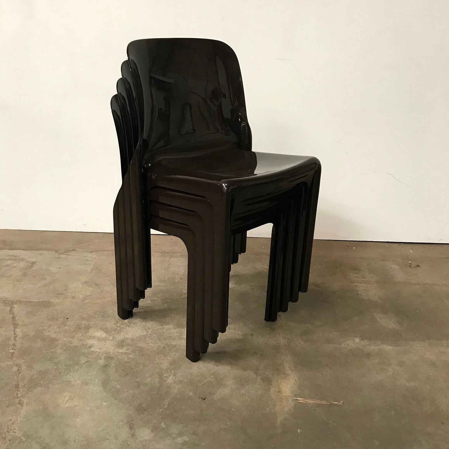 Set of two Selene stacking chairs in dark brown. These chairs are in good condition. Although they show some traces of wear like some scratches (pictures #12, #13 and #14), they are merely still very beautiful shiny brown. Pictures #16 and #17 show