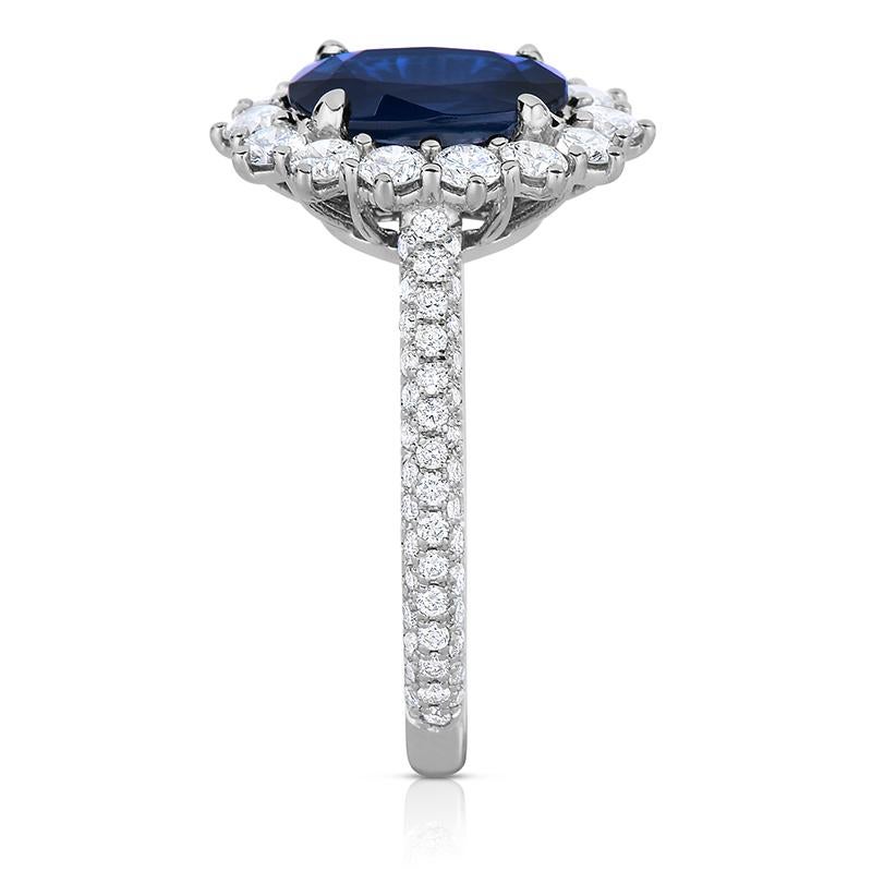 Made for a Princess! This stunning Oval Blue Sapphire is 9.2 x 7.1 mm and is enriched by a  1.04 ct total weight of FVS diamond melee in 14kt white with a micro-pave triple row band. If you don't see something, say something!  We would be happy to