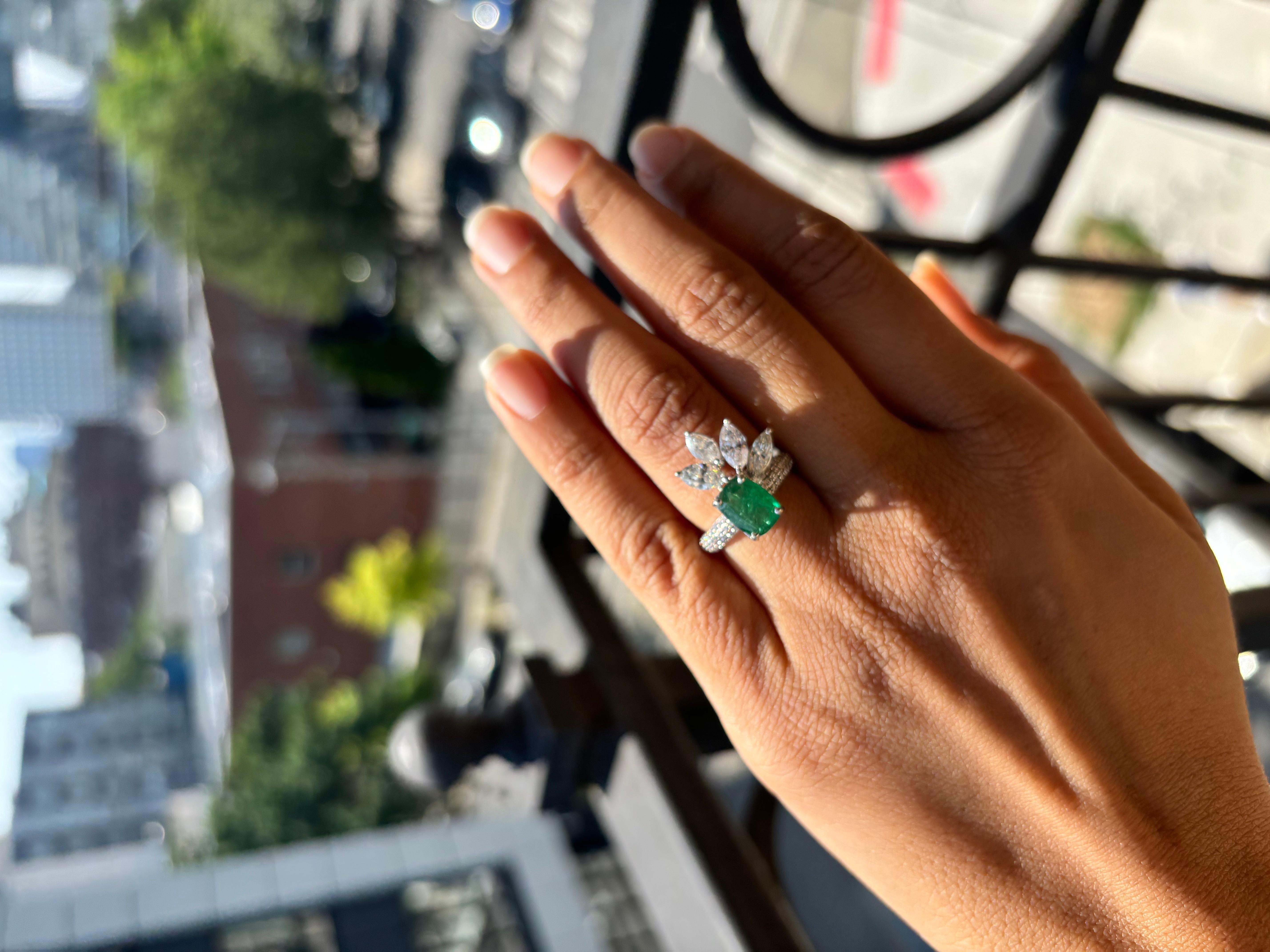 *Hallmarked with diamond weight and gold purity*

Elevate your jewelry collection with this captivating cocktail ring, meticulously crafted to dazzle under every light. Nestled at its center is a magnificent 2.23 carat emerald, vibrant and rich in