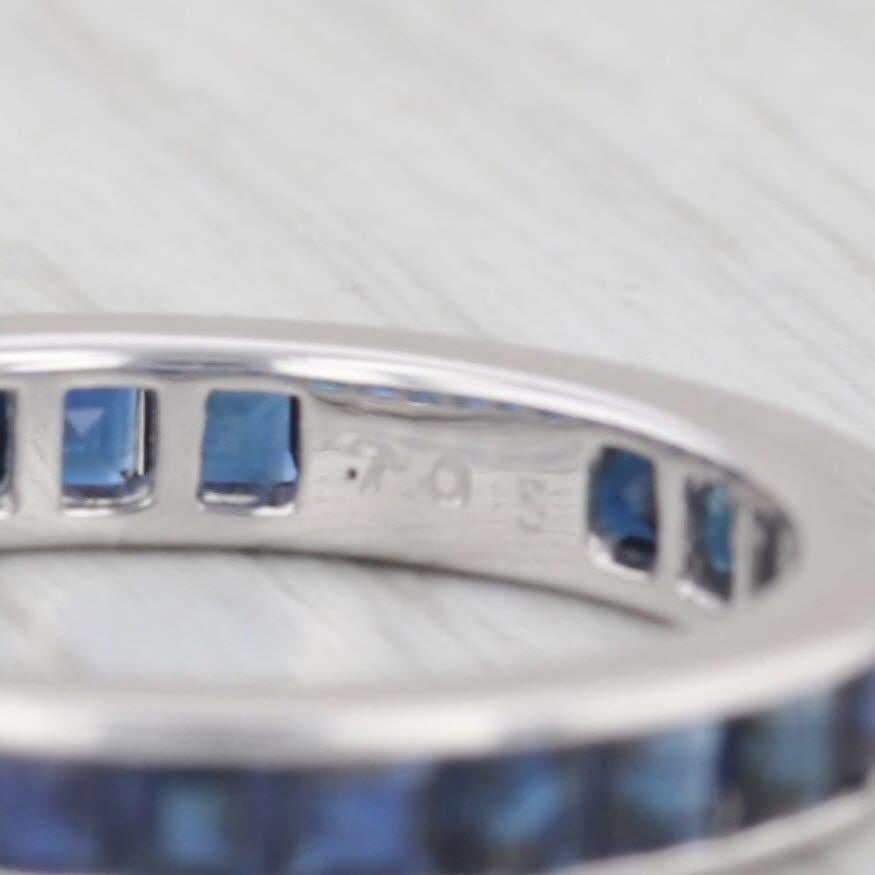 Gemstone Information:
- Natural Sapphires -
Total Carats - 1.96ctw
Cut - Step Cut Squares
Color - Dark Blue
Treatment - Heated

Metal: 18k White Gold
Weight: 2.4 Grams
Stamps: 750
Rise Above Finger: 2.4 mm
Band / Shank Width: 3.3 mm

This ring is a