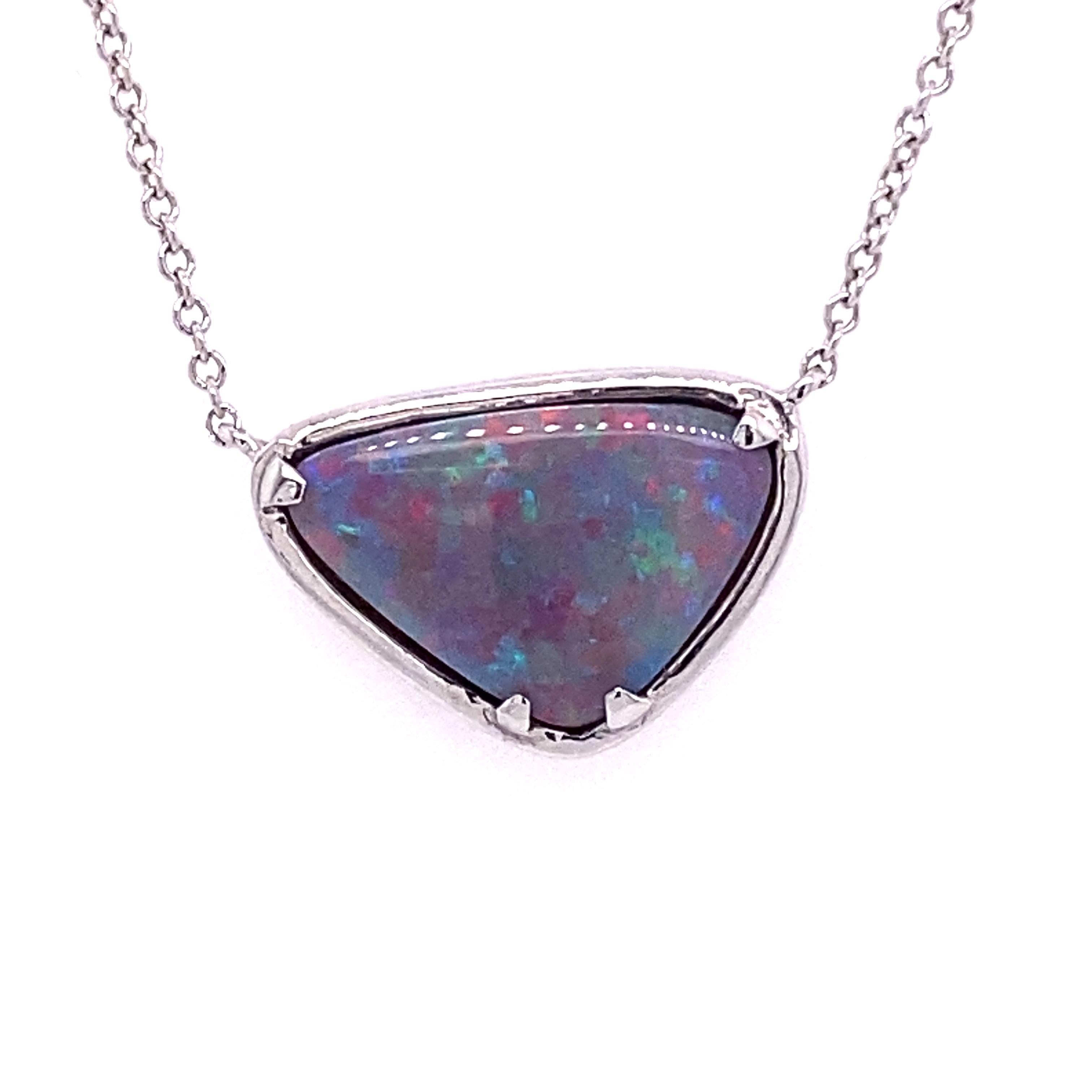 This beautiful pendant features a natural 1.96ctw natural black opal set in 18 karat white gold on an 18