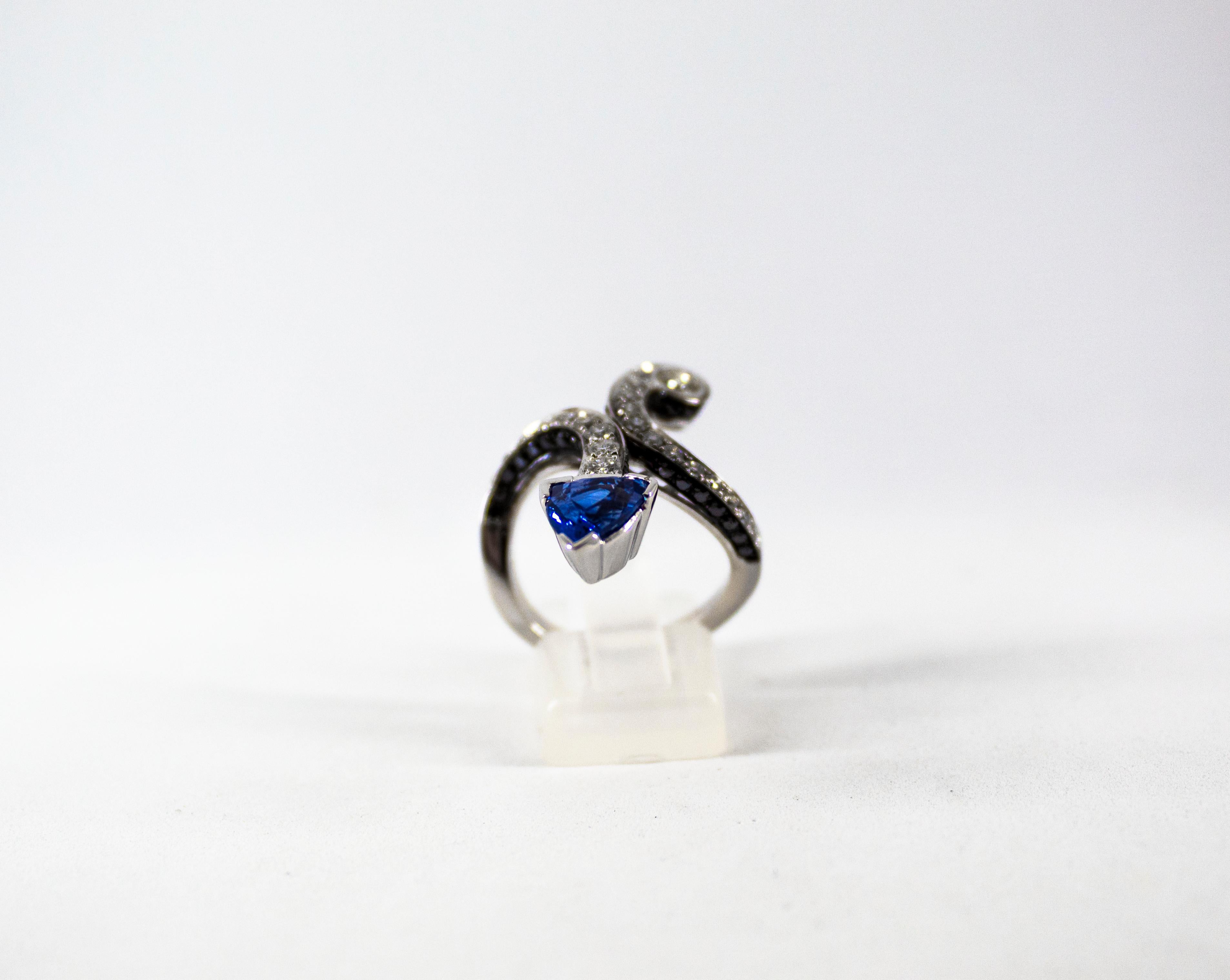 This Ring is made of 18K White Gold.
This Ring has 0.80 Carats of White Diamonds.
This Ring has 0.56 Carats of Black Diamonds.
This Ring has a 1.97 Carats Natural Blue Sapphire.
Size ITA: 16 USA: 7 1/2
We're a workshop so every piece is handmade,